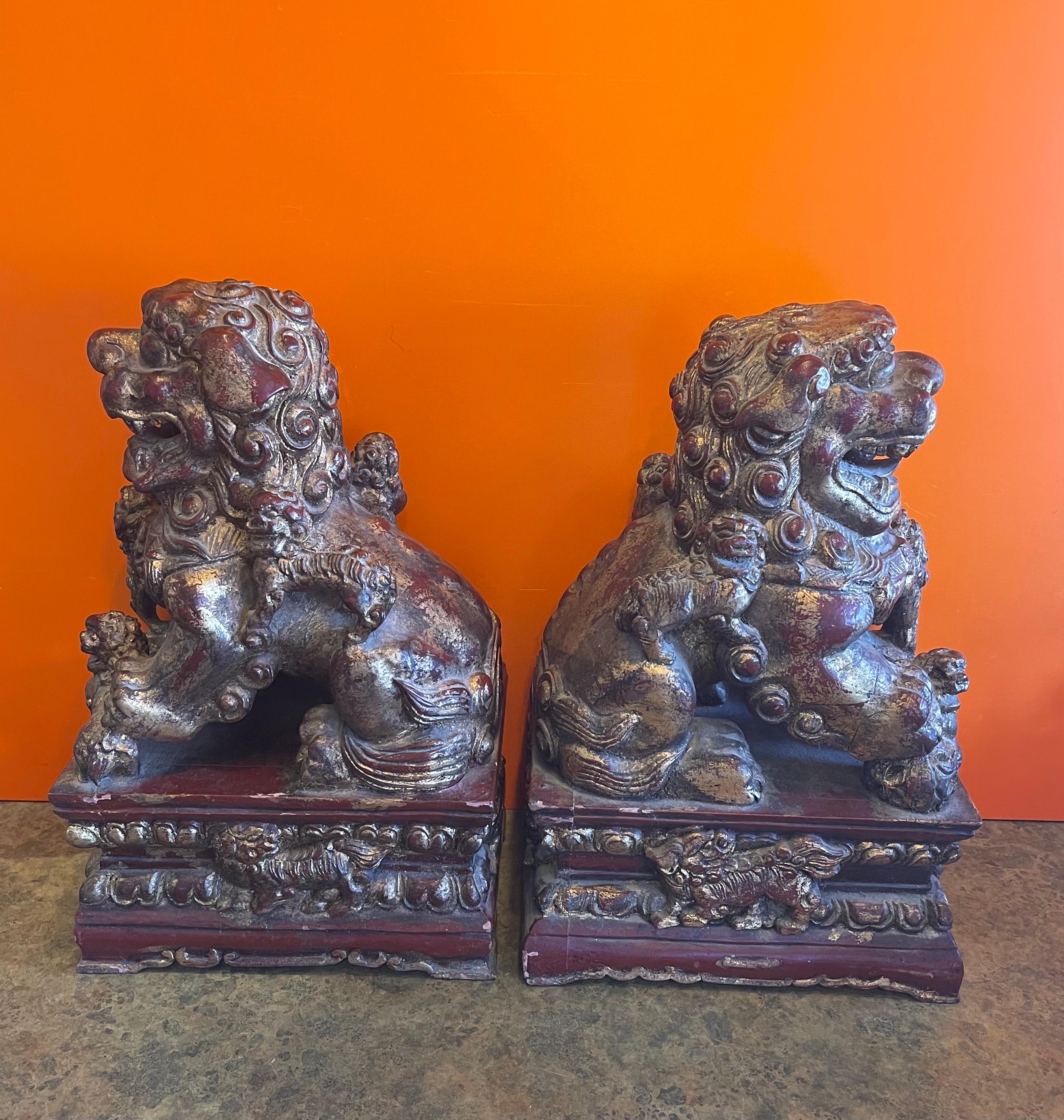 Pair of Large Vintage Chinese Hand Carved Gold Giltwood Foo Dogs In Good Condition For Sale In San Diego, CA