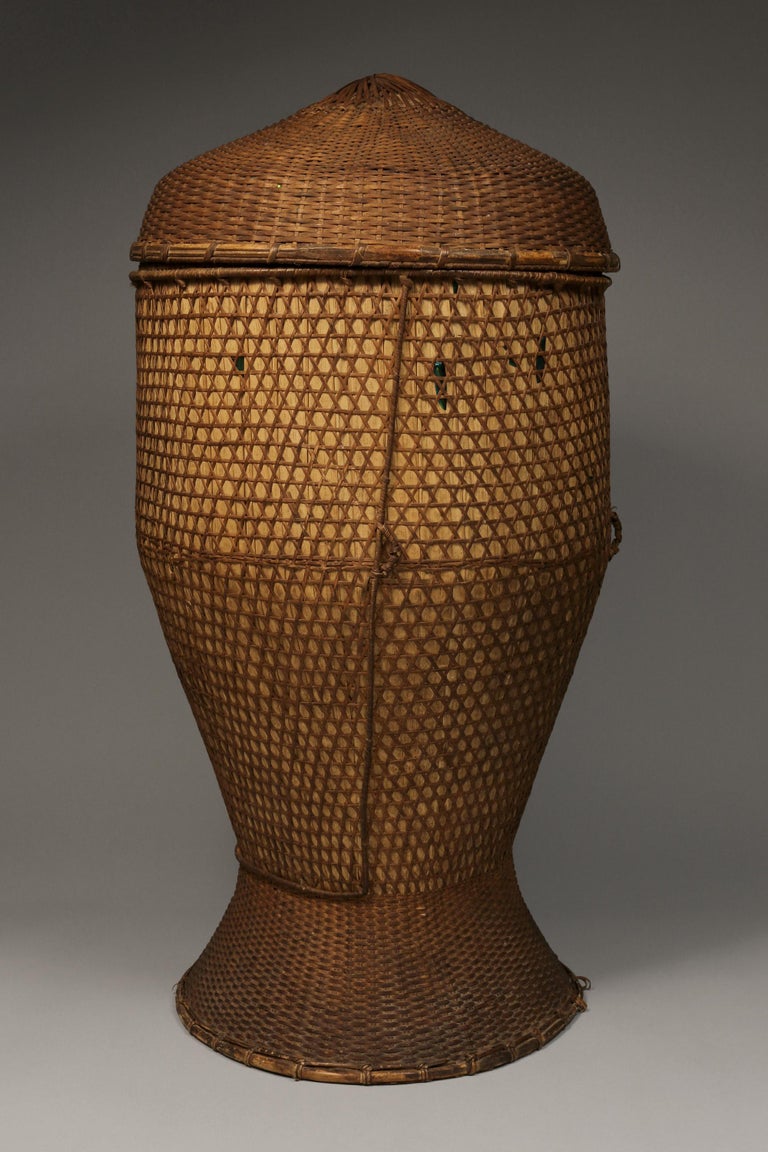 Pair of large vintage grain storage baskets, Thailand, mid-20th century
This basket comes from the Northern Hills Tribes of Thailand, hand-woven from bamboo and rattan.

Conditions: The baskets are in good condition. Shows some wear commensurate