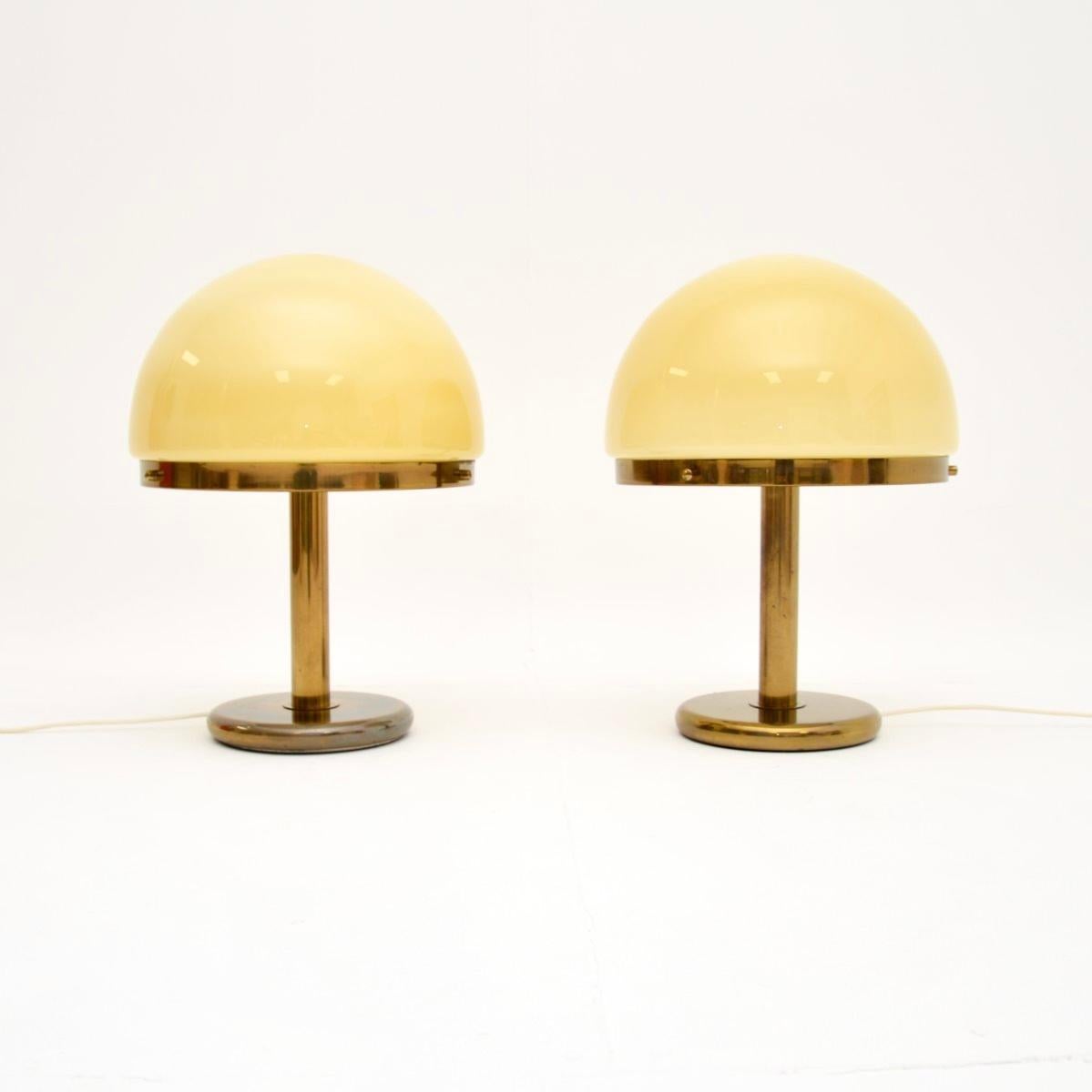 A fantastic pair of large vintage Italian brass and glass table lamps. They were made in Italy, they date from the 1970’s.

The quality is exceptional, they are a great size and are very impressive. The glass shades are a beautiful colour, and look