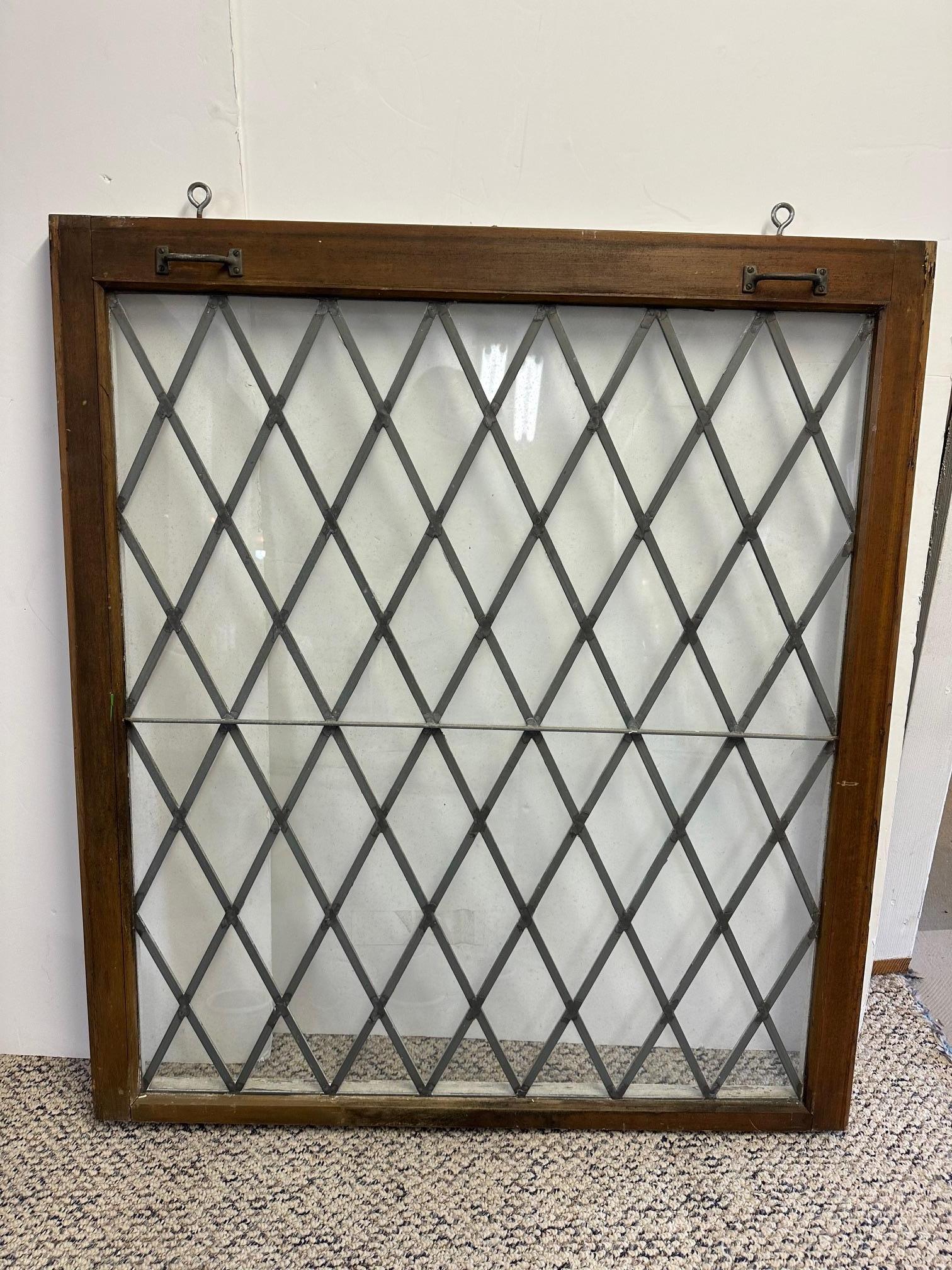 Large pair of leaded glass windows having diamond harlequin panes.
Wooden frames show age appropriate signs of wear as shown in photos, especially the painted sides.  No broken glass!