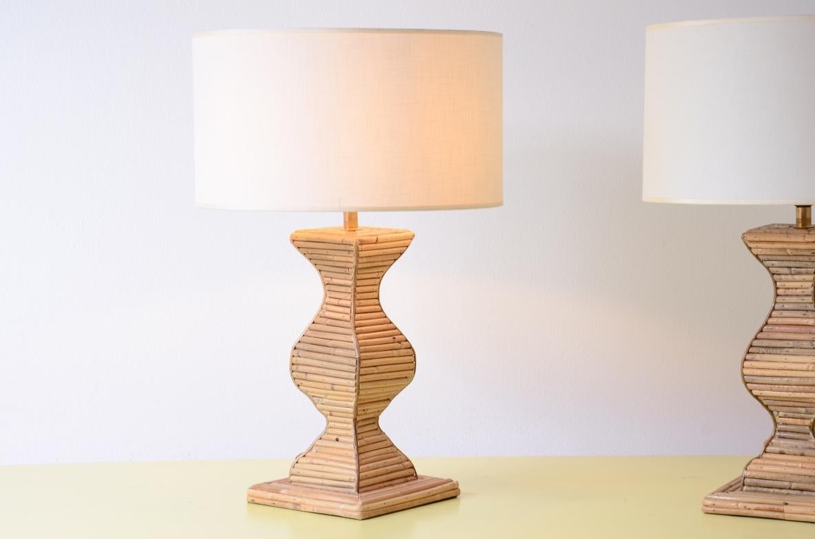 COD-2864
Pair of large, shaped, rattan-covered table lamps with fabric shades.

Manufacturing Vivai del Sud, Italy, ca. 1960.