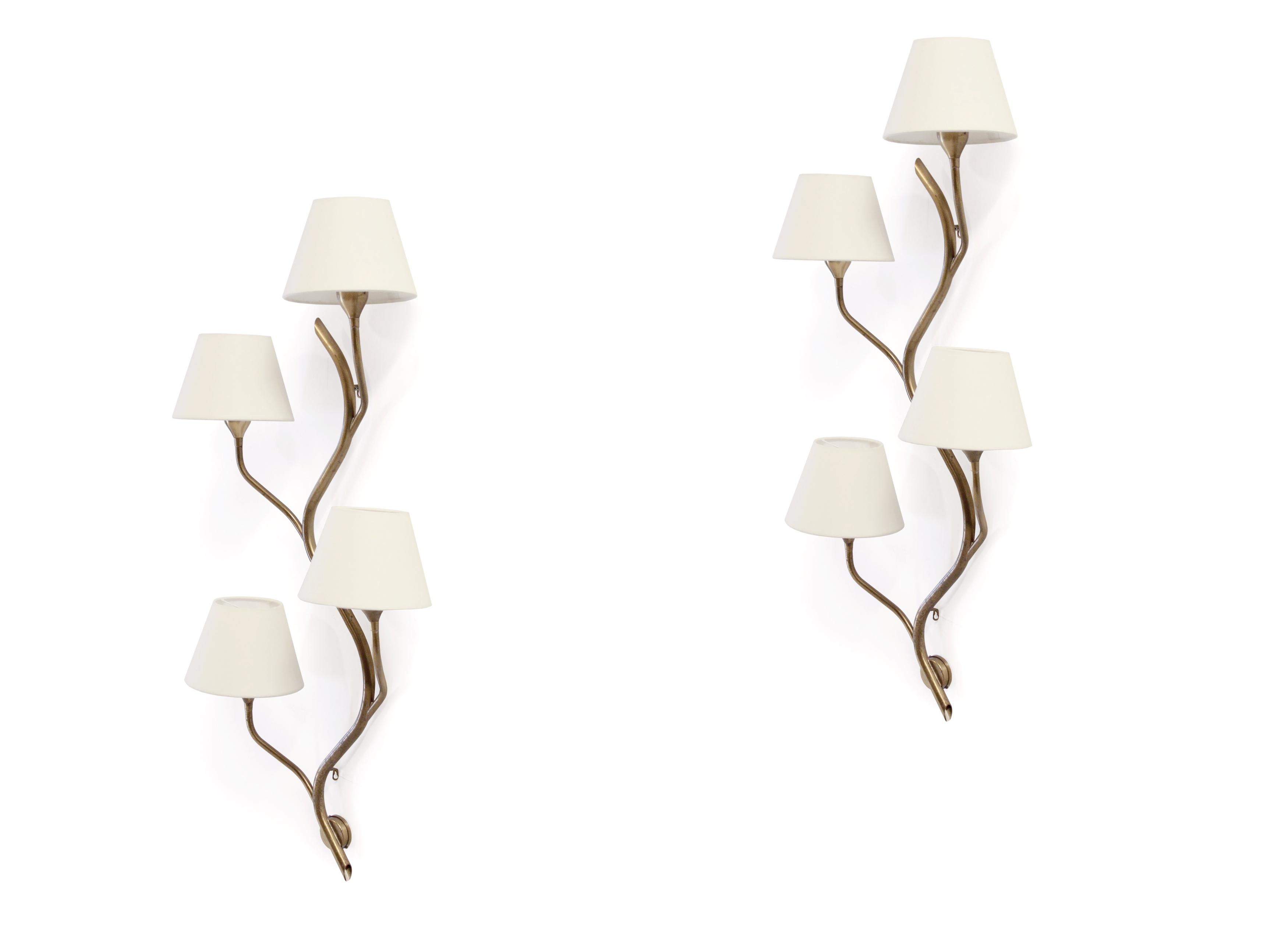 Wonderful and organic pair of four-armed wall lamps in brass. The lamps are designed and made in Norway by Astra from circa 1960s second half. Both lamps are fully working and in excellent vintage condition with some minor age related surface marks.