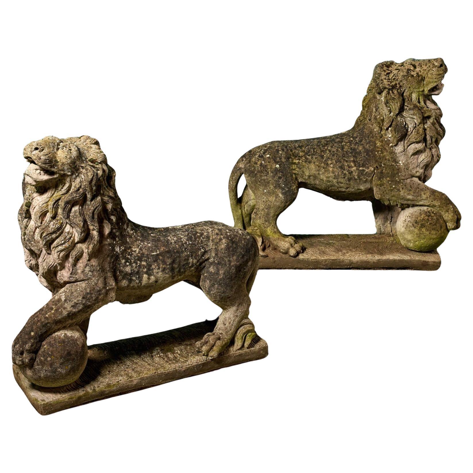 Pair of Large Weathered Stone Lion Statues For Sale