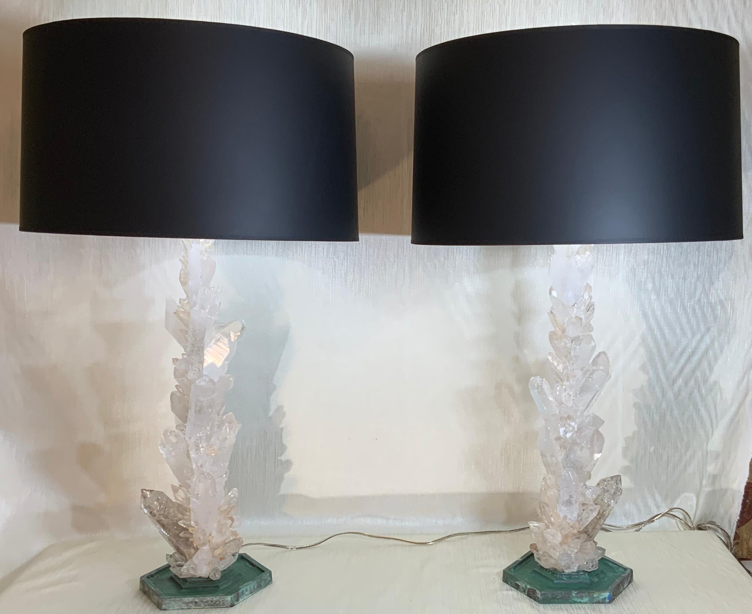 Elegant pair of table lamps made of hand selected large and smaller genuine White color rock quartz crystal pieces, artistically put together to make beautiful and impressive pair of table lamps.
19th century bronze base size: 8” x 8” x