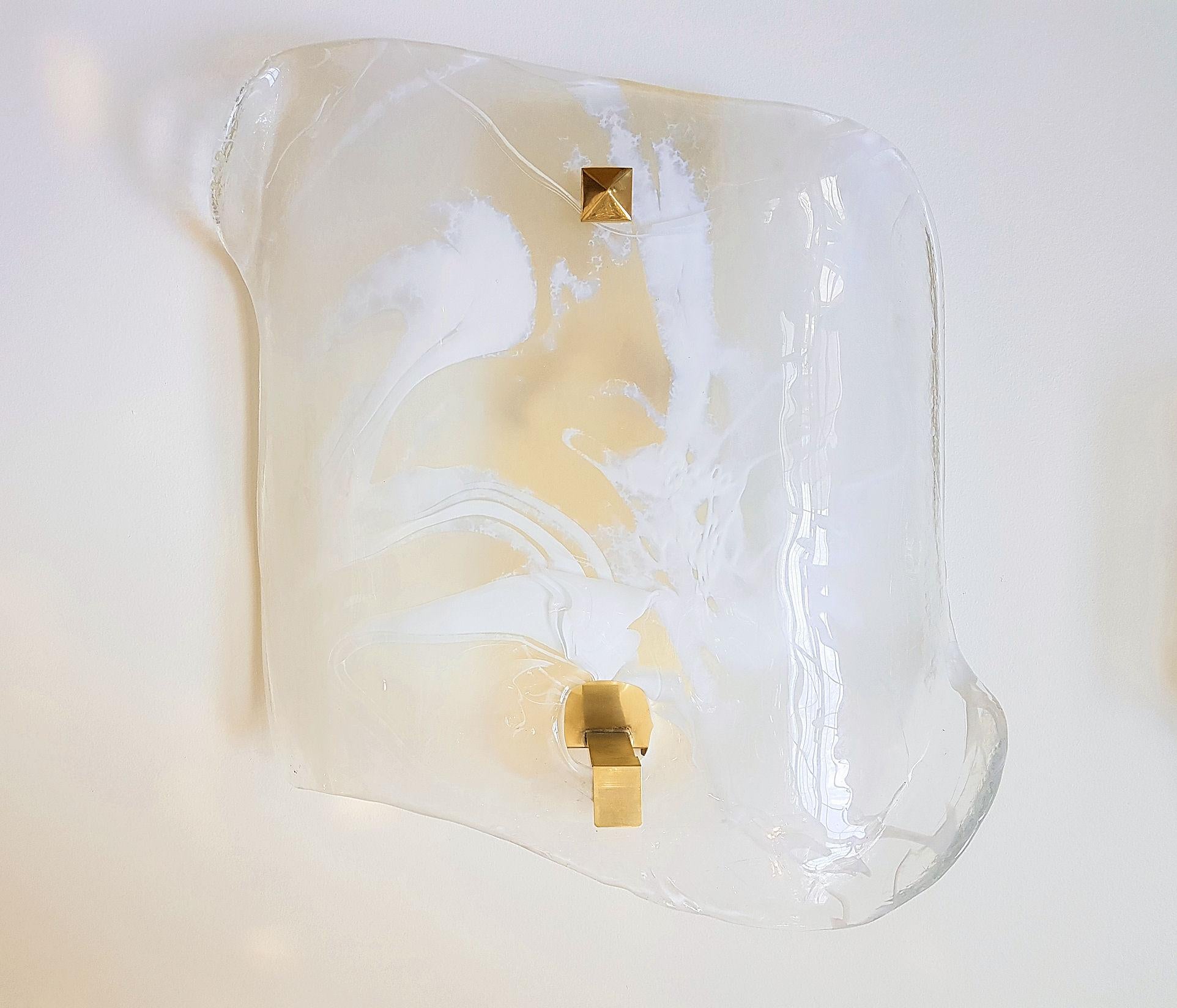 Pair of large asymmetrical square shape Murano glass wall sconces, with brass mounts.
Made of thick Murano glass, with a unique abstract handmade white veined color.
The Murano glass sconces are attributed to AV Mazzega, Italy, 1960s
2-light