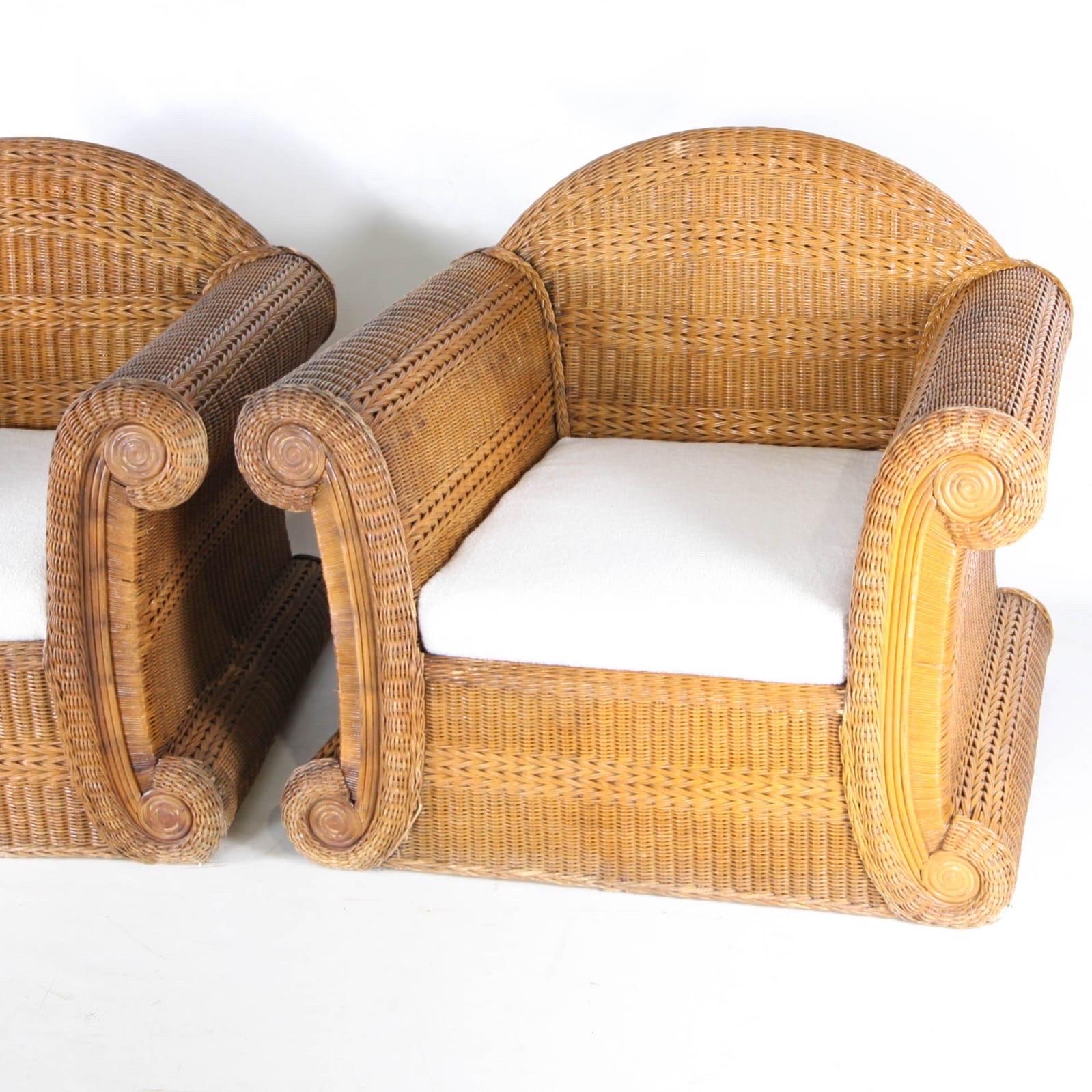 Exceptional pair of large sculptural wicker armchairs with new bouclé fabric cushions.
Amazing craftsman work from the seventies. Great comfort and good condition.
