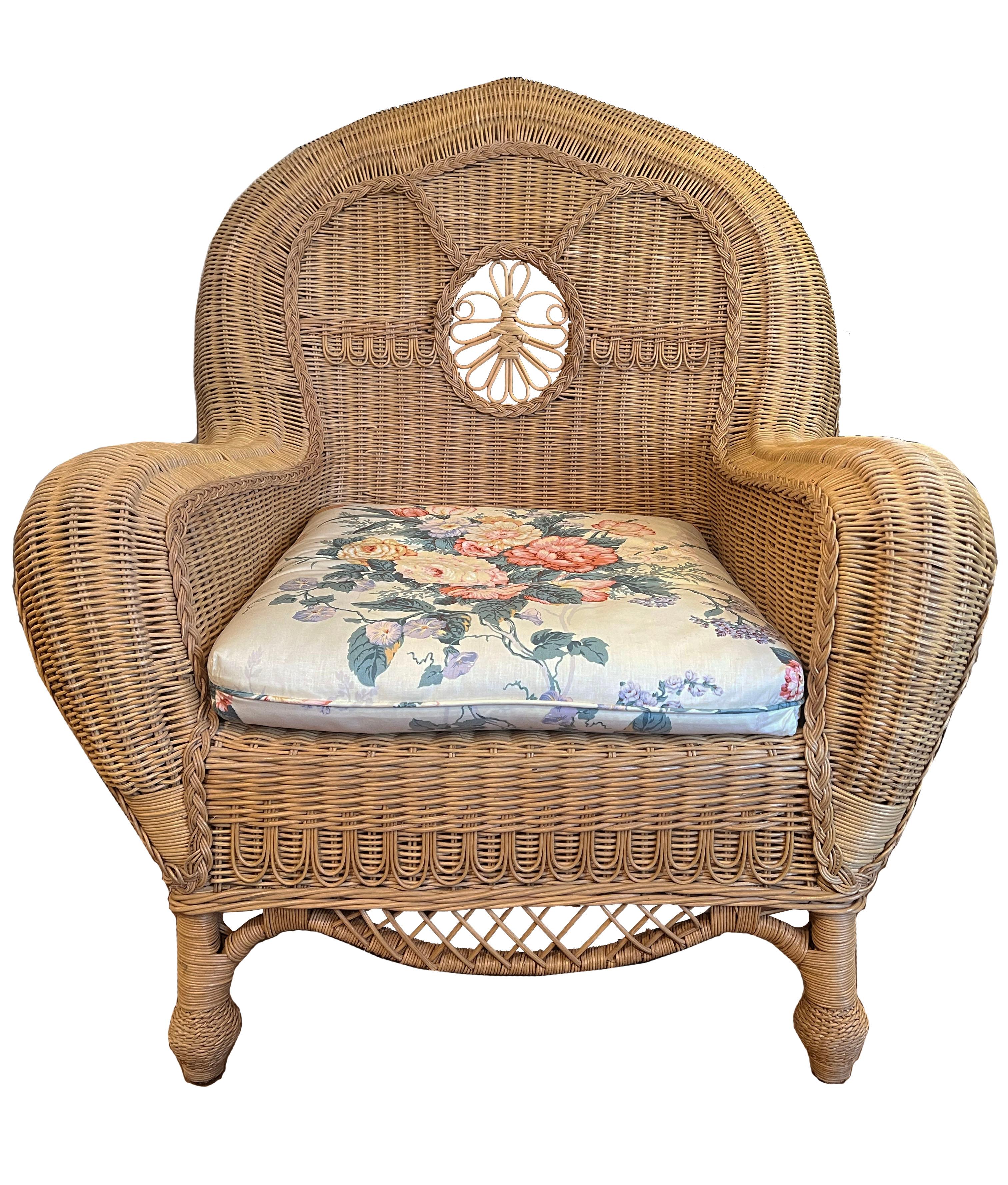 Pair of Large Wicker Armchairs w/ fitted upholstered seat cushion. Seat cushion is removable. From Andre Leon Talley's Collection.

A striking pair of large wicker armchairs, meticulously crafted to embody both elegance and comfort. Woven with