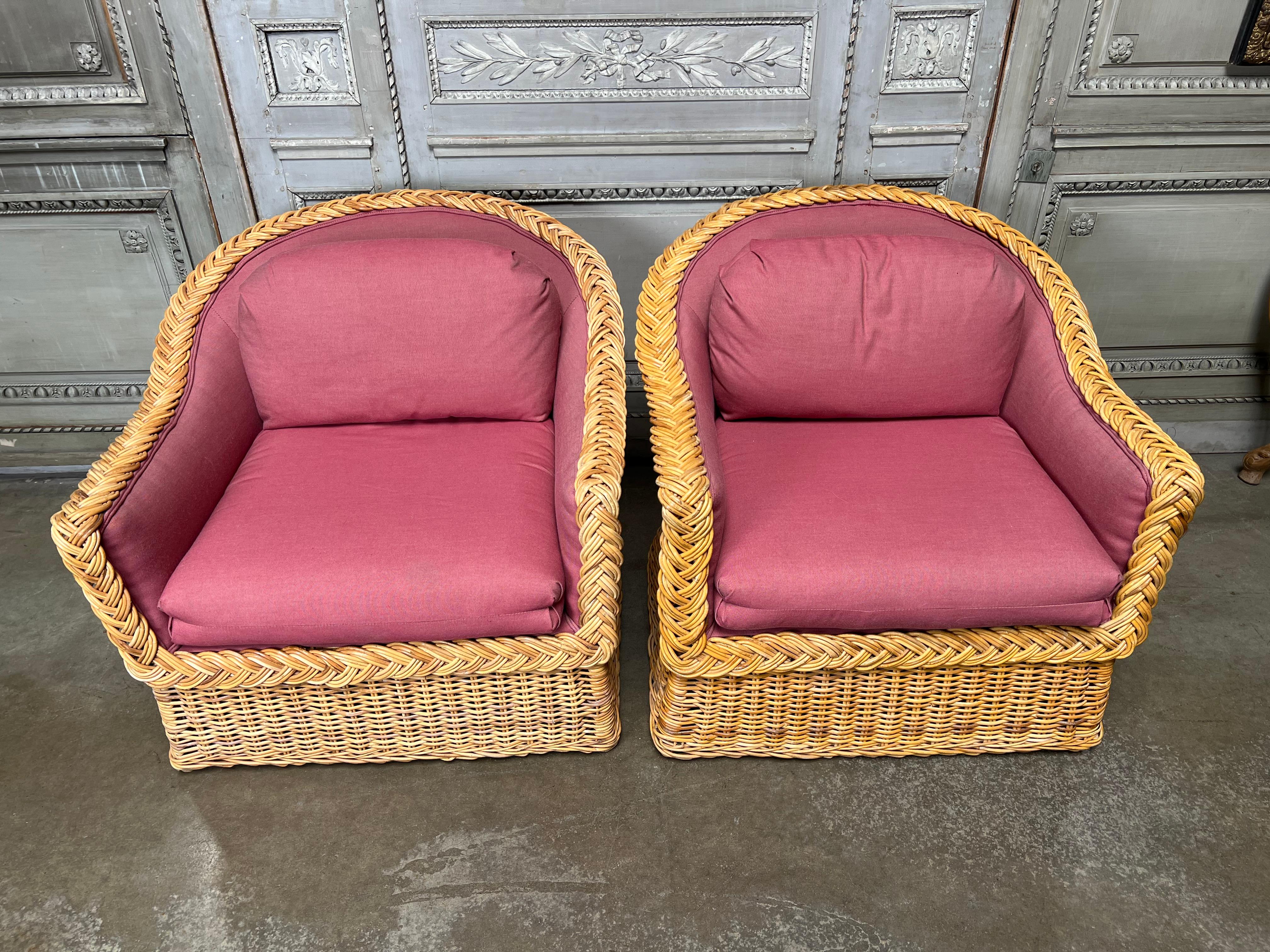 A large pair of vintage Wicker Works club chairs from the 1980s. These comfortable chairs are upholstered in clean usable fabric, but we didn't reupholster them. They are in nice condition and one is slightly lighter than the other due to sun