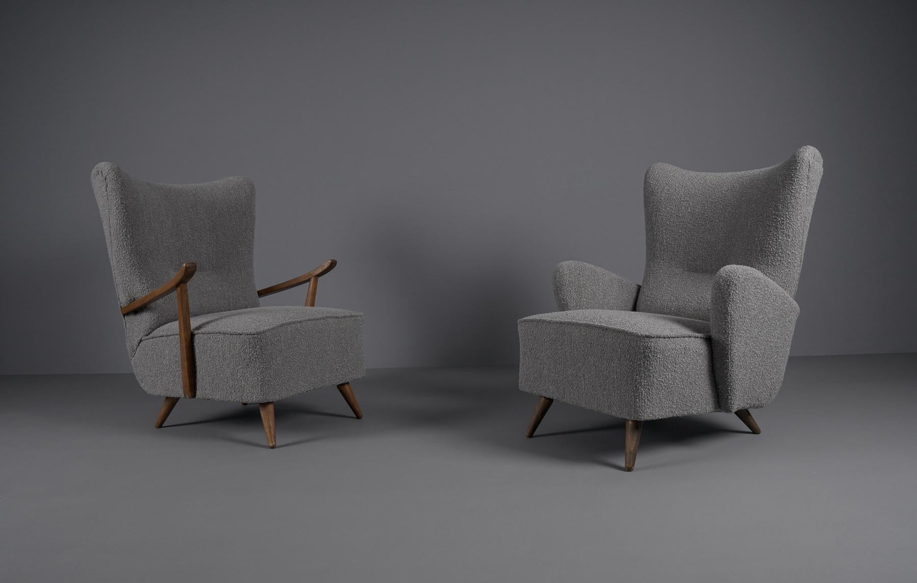 Awesome armchairs. 

New upholstery in grey Boucle fabric.

It is a ladies and a men's armchair.

Two different sizes/seat heights. 

With wooden armrests: seat height 41cm, total height 96cm. Seat width 57cm, total width 82cm. Seat depth 57cm,