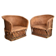 Pair of large wood and leather mexican armchairs, 1970s.