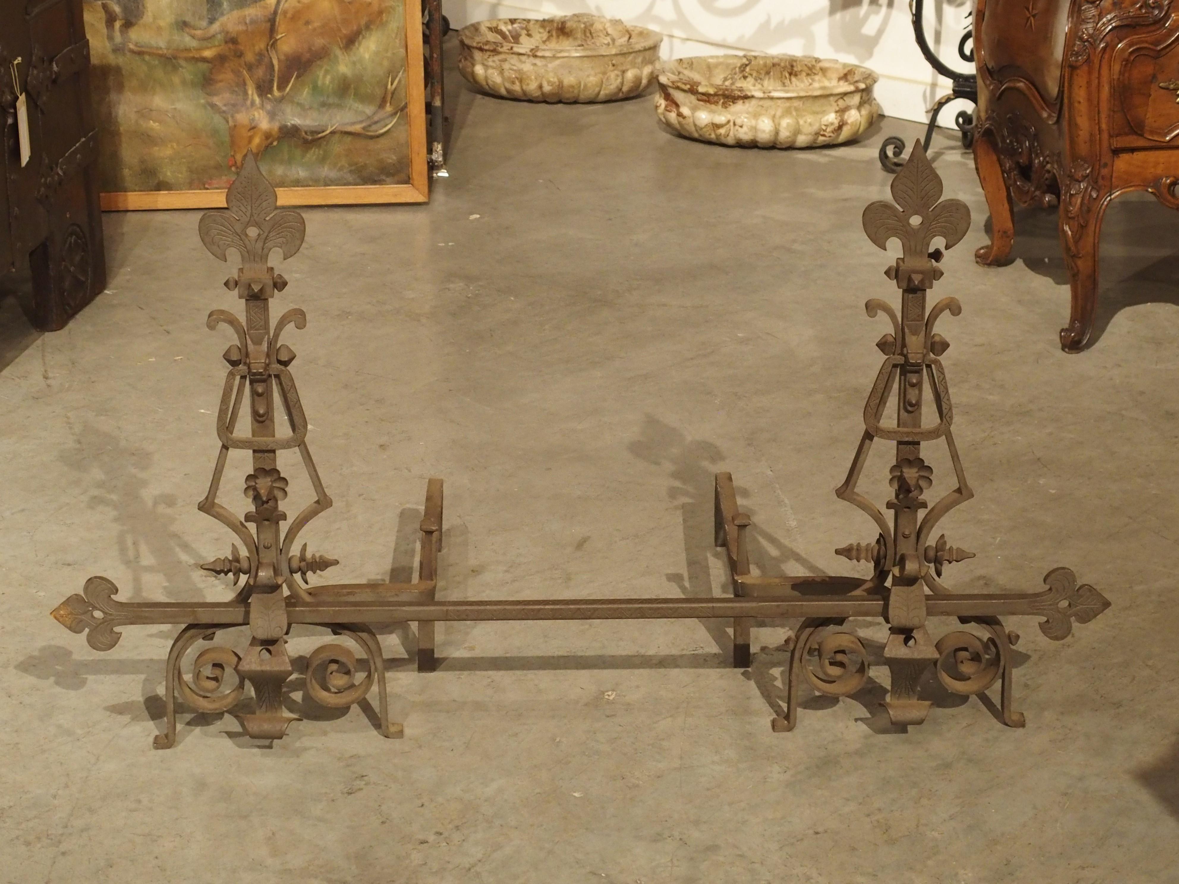 French Pair of Large Wrought Iron Fleur De Lys Chenets with Cross Bar For Sale