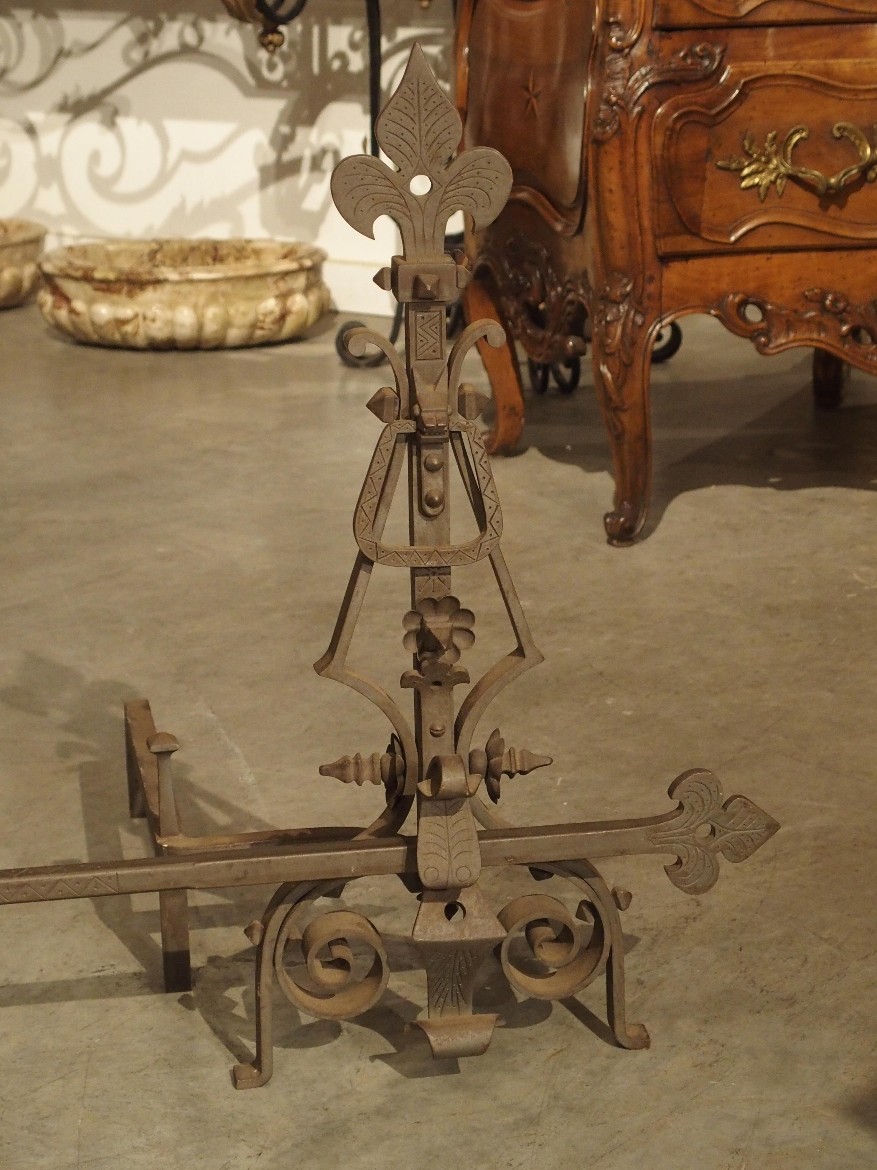 Pair of Large Wrought Iron Fleur De Lys Chenets with Cross Bar In Good Condition For Sale In Dallas, TX