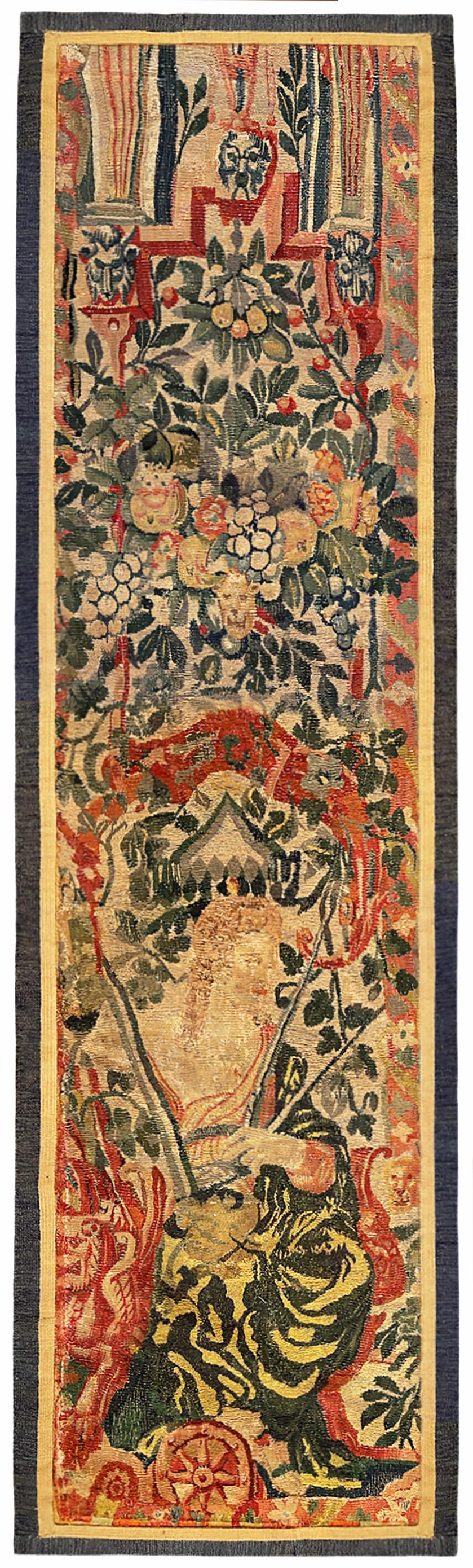 A pair of late 16th century Flemish historical tapestry panels. These vertically oriented decorative tapestry panels depict female figures at bottom, sitting within an elaborate floral reserve, with flowers and with portions of an arch at top. The