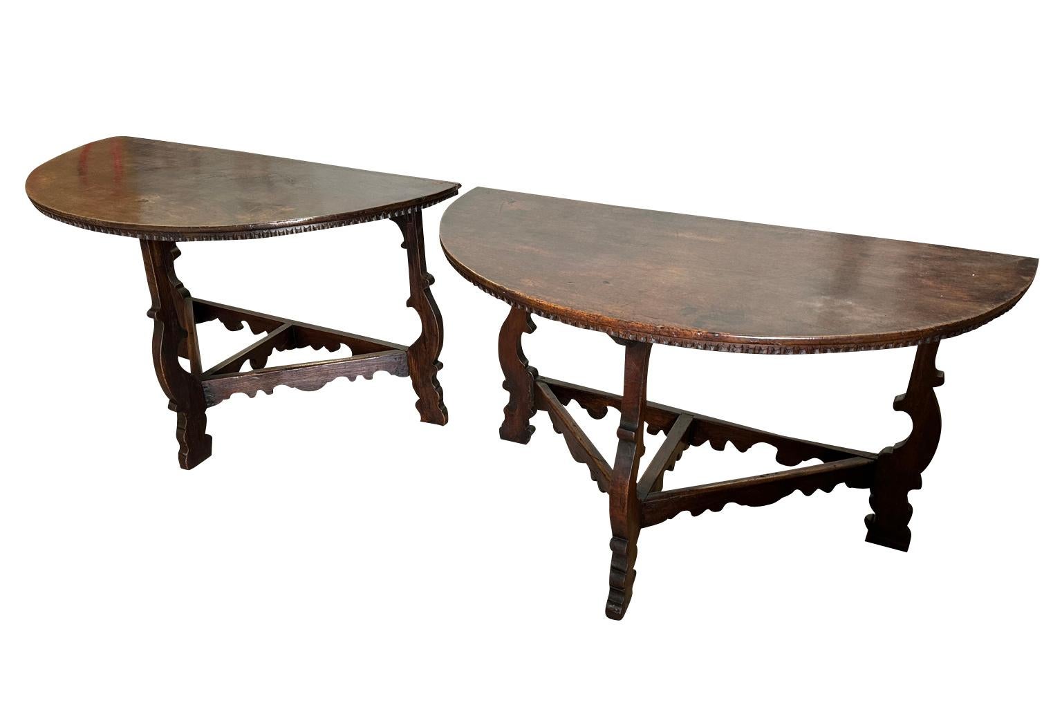 A stunning pair of late 17th century Demi Lune Console Tables from the Lombardy region of Italy.  Beautifully constructed from handsome walnut with lyre shaped legs and dentilated detail to the tops.  Fabulous patina, warm and luminous.