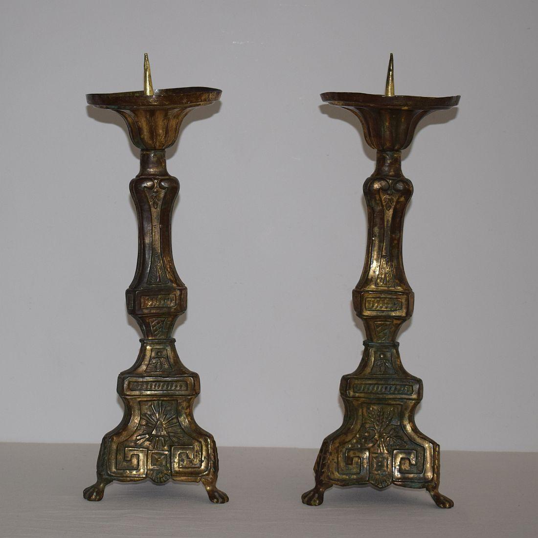 Great pair of Louis XVI style brass candleholders with traces of fire gilding. Beautiful weathered and great decoration, France, circa 1780.
Weathered and small losses.