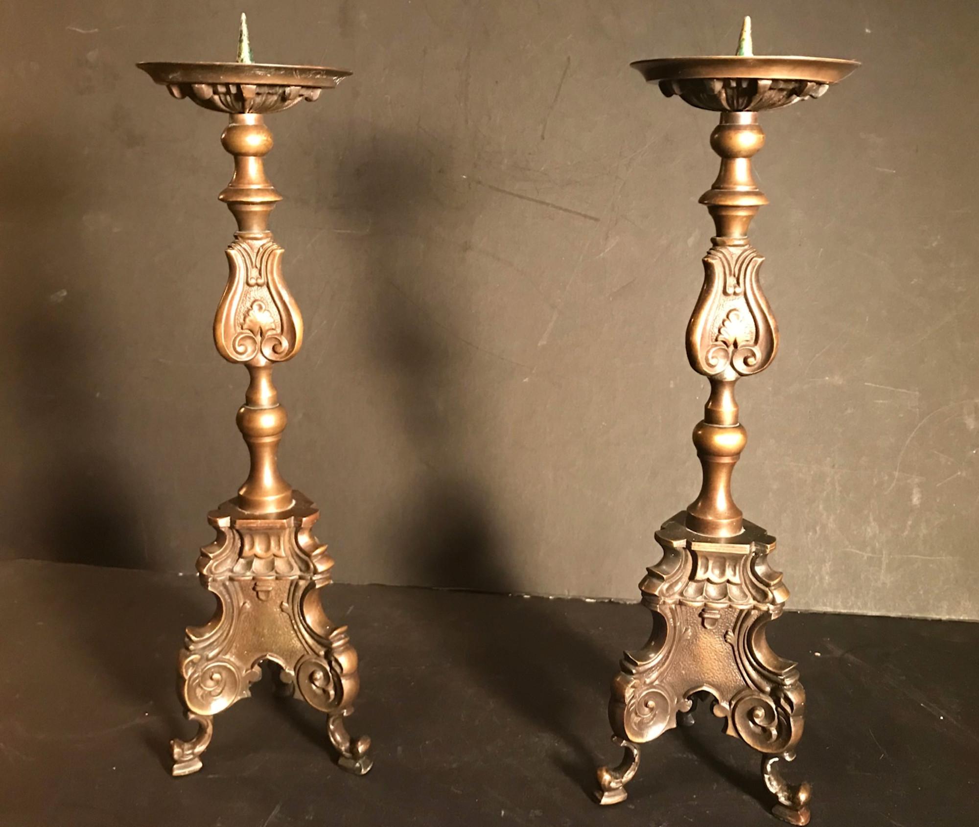 Pair of late 18th century Italian bronze Baroque Pricket candlesticks

A striking pair of Italian bronze pricket candlesticks. Each supports a baluster shaped stem with a spreading triform base embossed with Baroque foliate and scroll motives. These