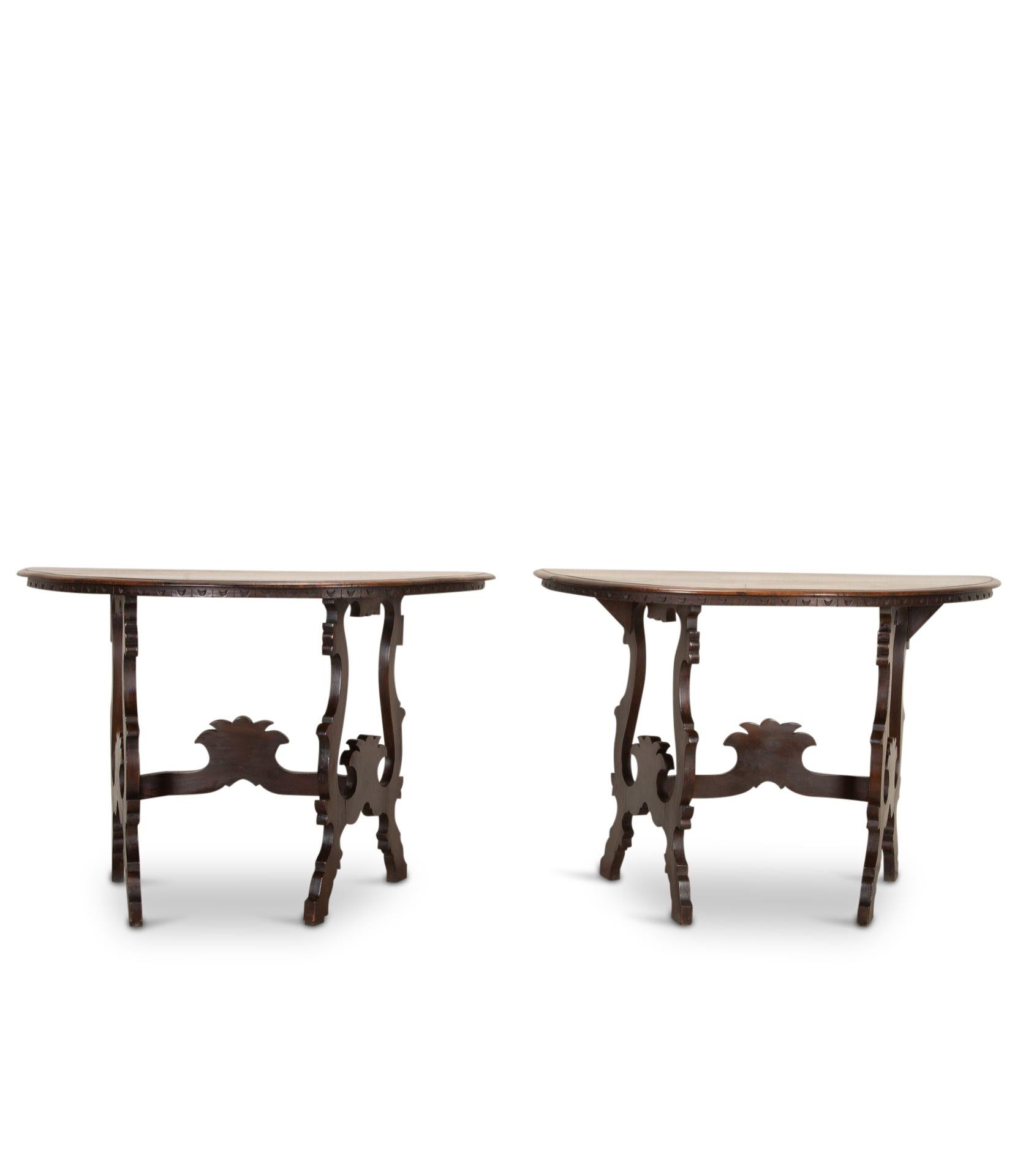A wonderful pair of Italian late 18th Century solid walnut console tables. Gorgeous warm tones and detailed carving showing true quality. The tables will also link together to make a round centre table. Originating from Tuscany, Italy. Circa