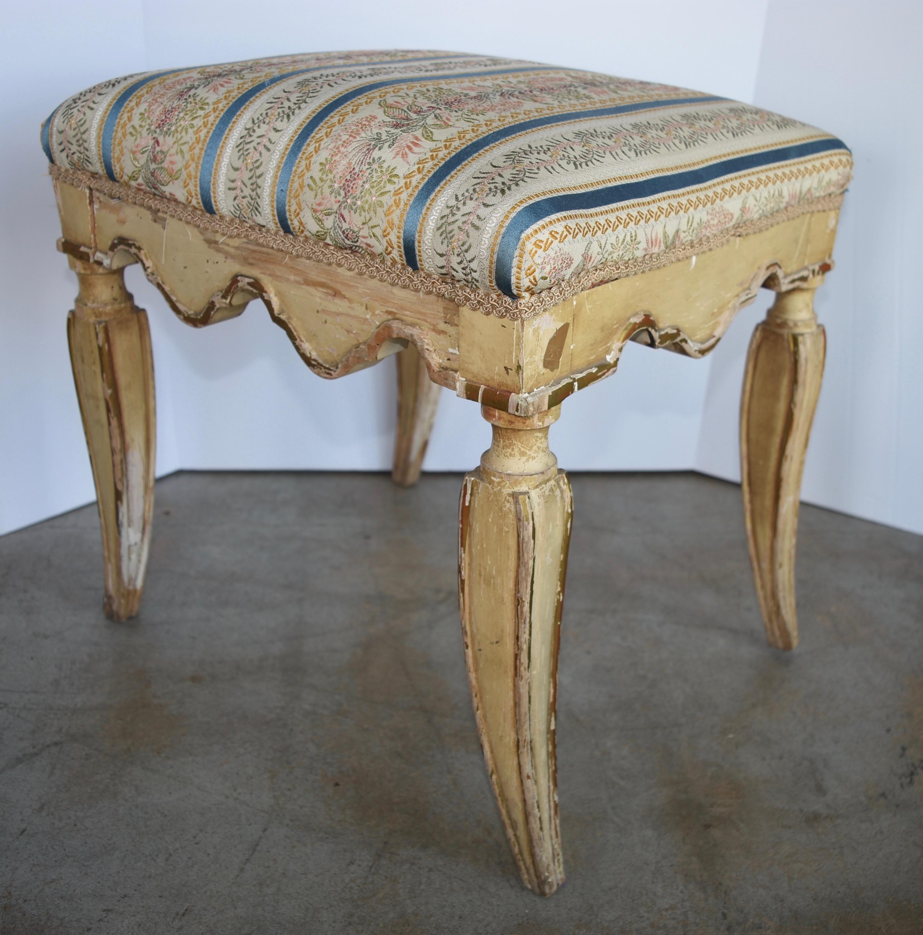 Very sweet pair of Italian benches, with beautiful gold leaf finish. These are the perfect size just about anywhere and are structurally sound. They have been newly upholstered in muslin.