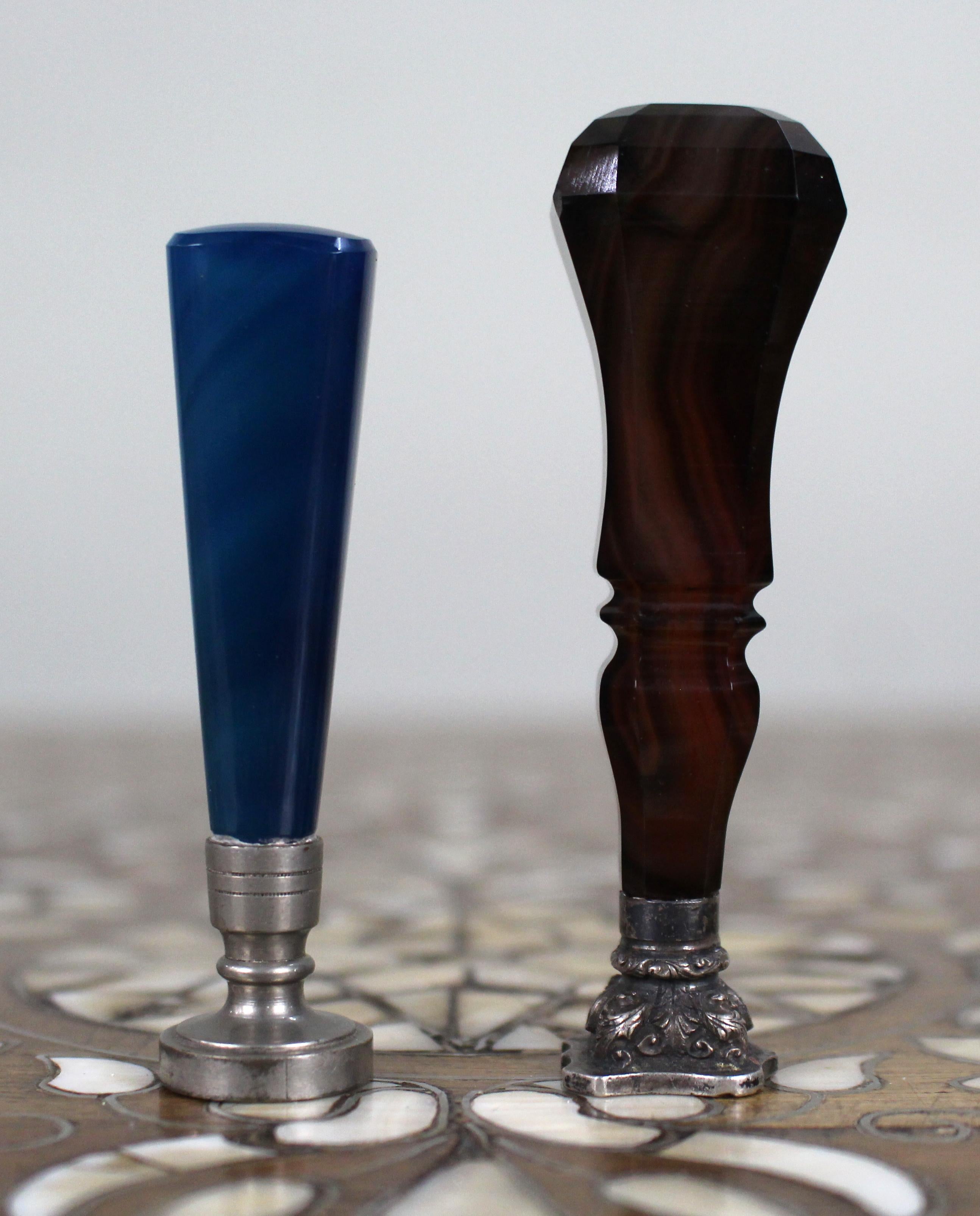 Pair of Late 19th c. Agate Monogram Wax Seals


A decorative pair of antique desk wax seals, each with a polished banded agate handle and metal mount, dating from the late 19th century.

One seal is fashioned with a faceted reddish-brown agate