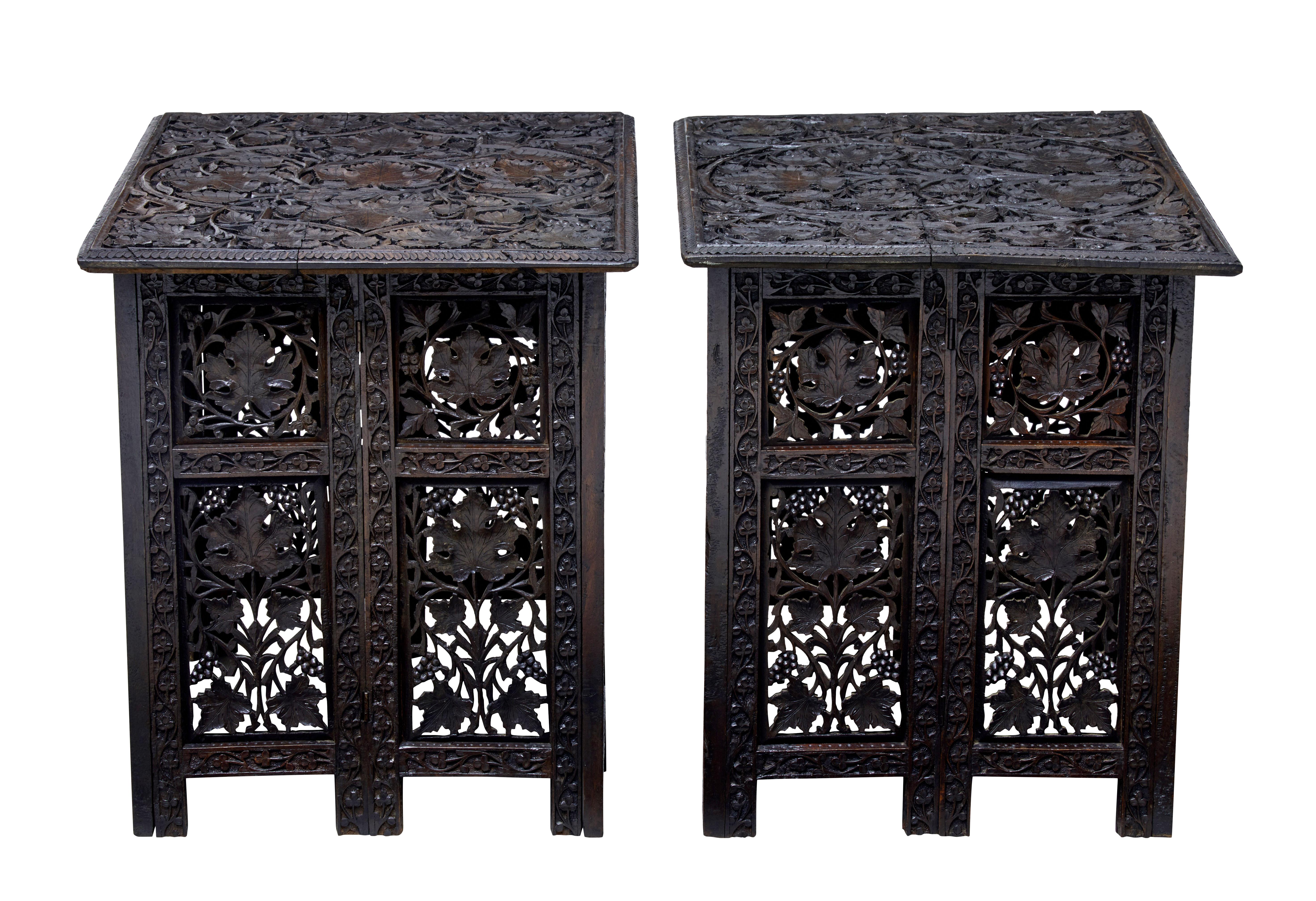 Pair of Anglo-Indian carved hardwood tables, circa 1895.

Increasingly more difficult to find in pairs. Table features a carved tray top that sits on a foldable base.

Deep carved leaves to the top surface which would need covering with glass
