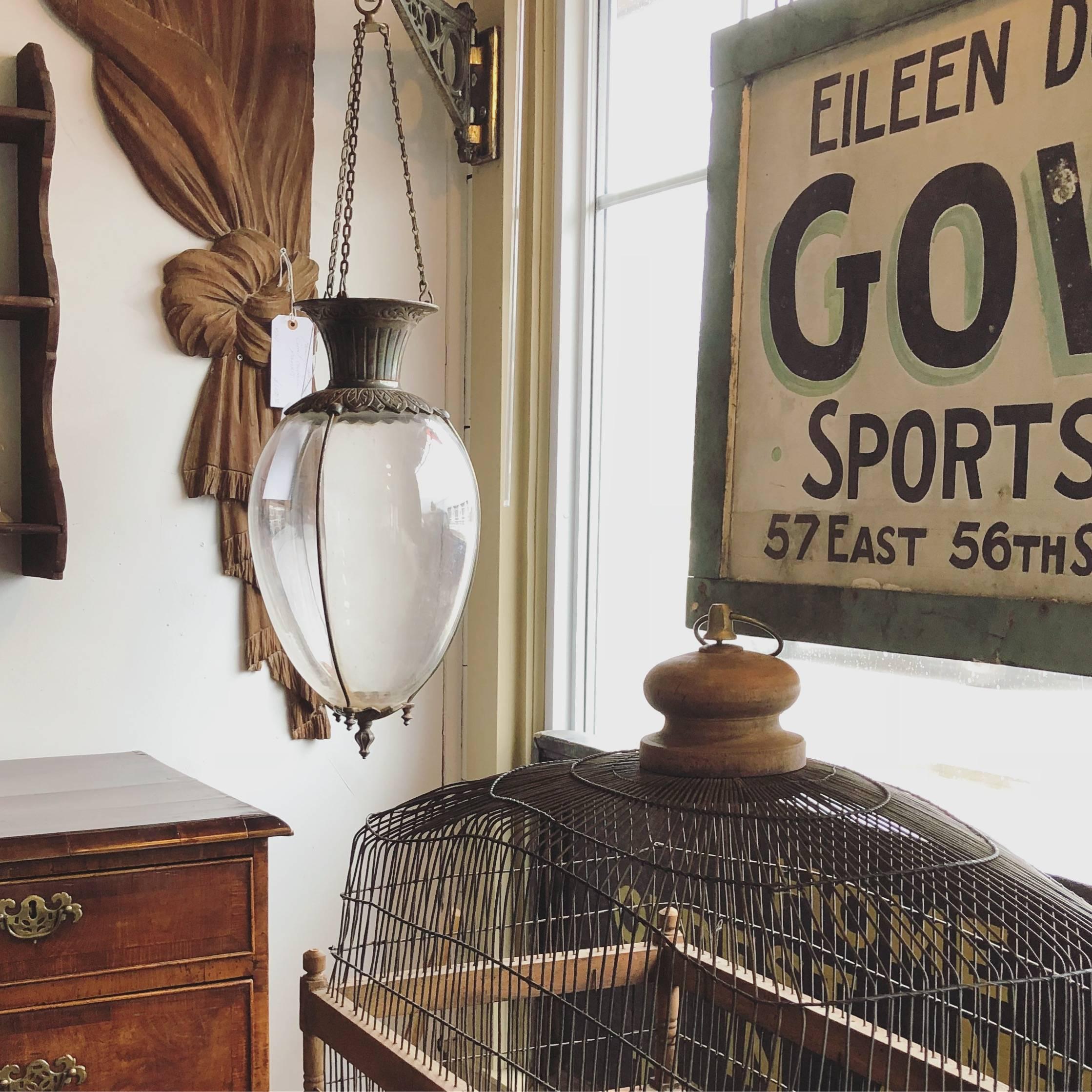 Pair of apothecary show globes with original brass wall brackets, circa 1900. 

Dimensions: Globes (including chain) 36