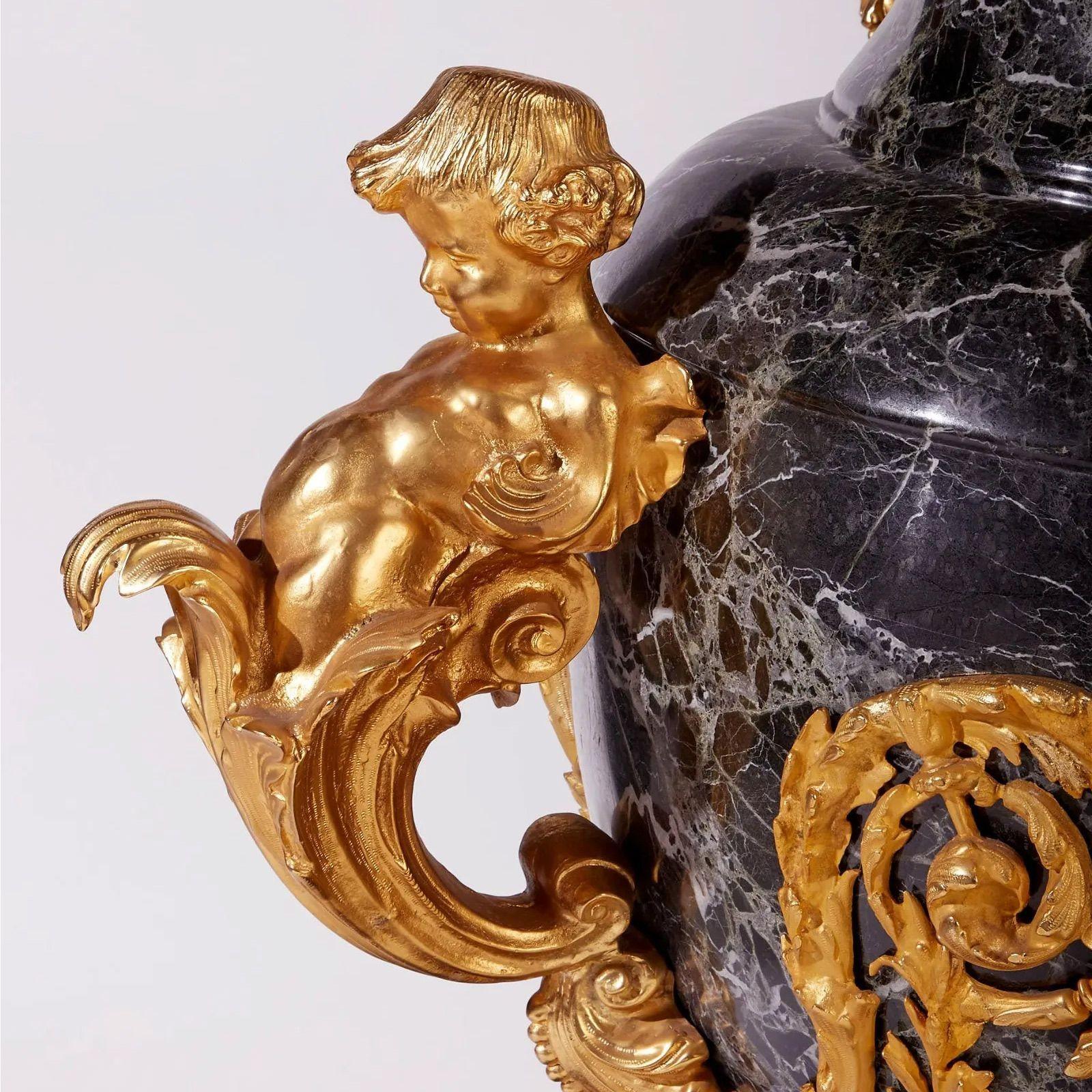 Pair of marble gilt-bronze floor Urns, late 19th century

In the style of Imperial Russia, a pair of black marble urns ornamented with gilt-bronze putti figures
2 pieces
 
Dimensions

55