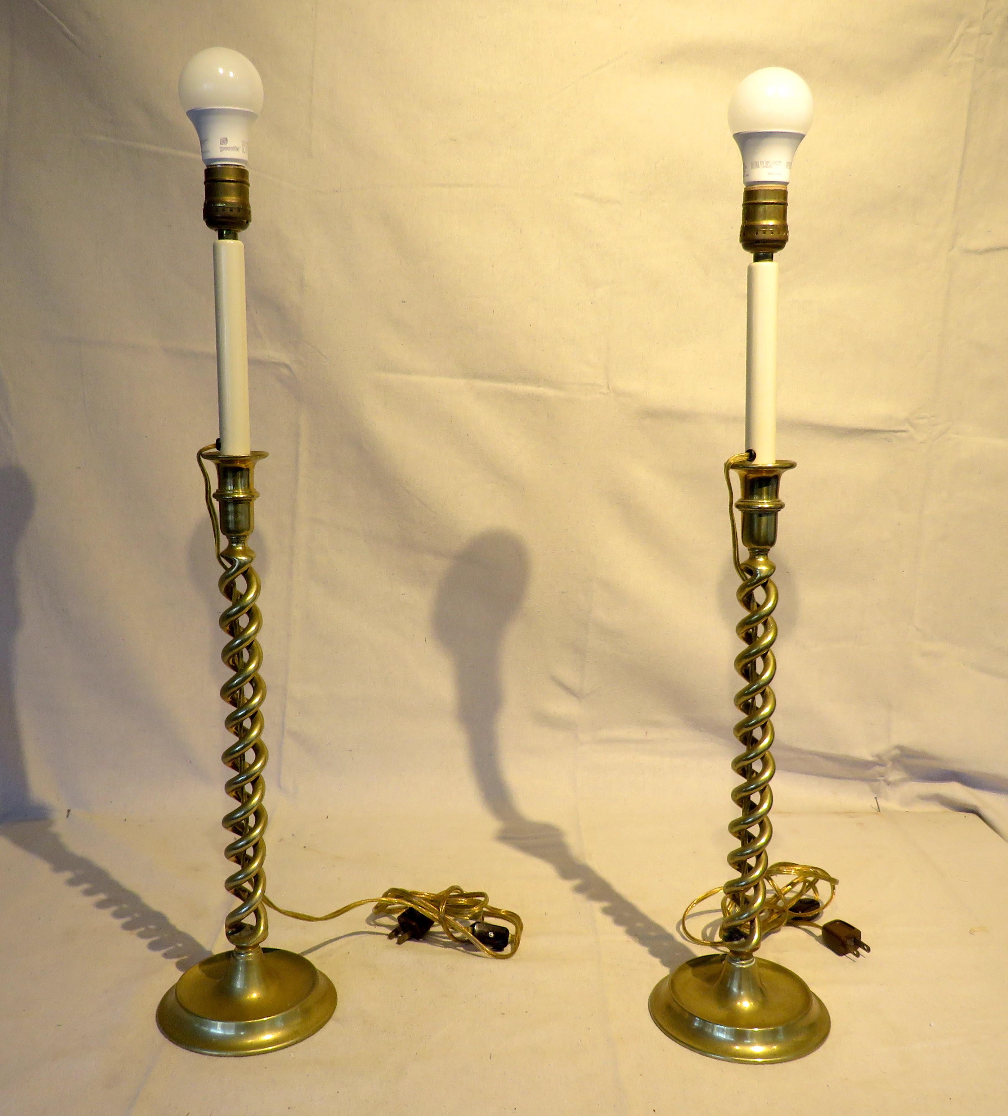 Pair of 19th century brass Barley twist candlestick lamps, electrified, with woven cane shades.