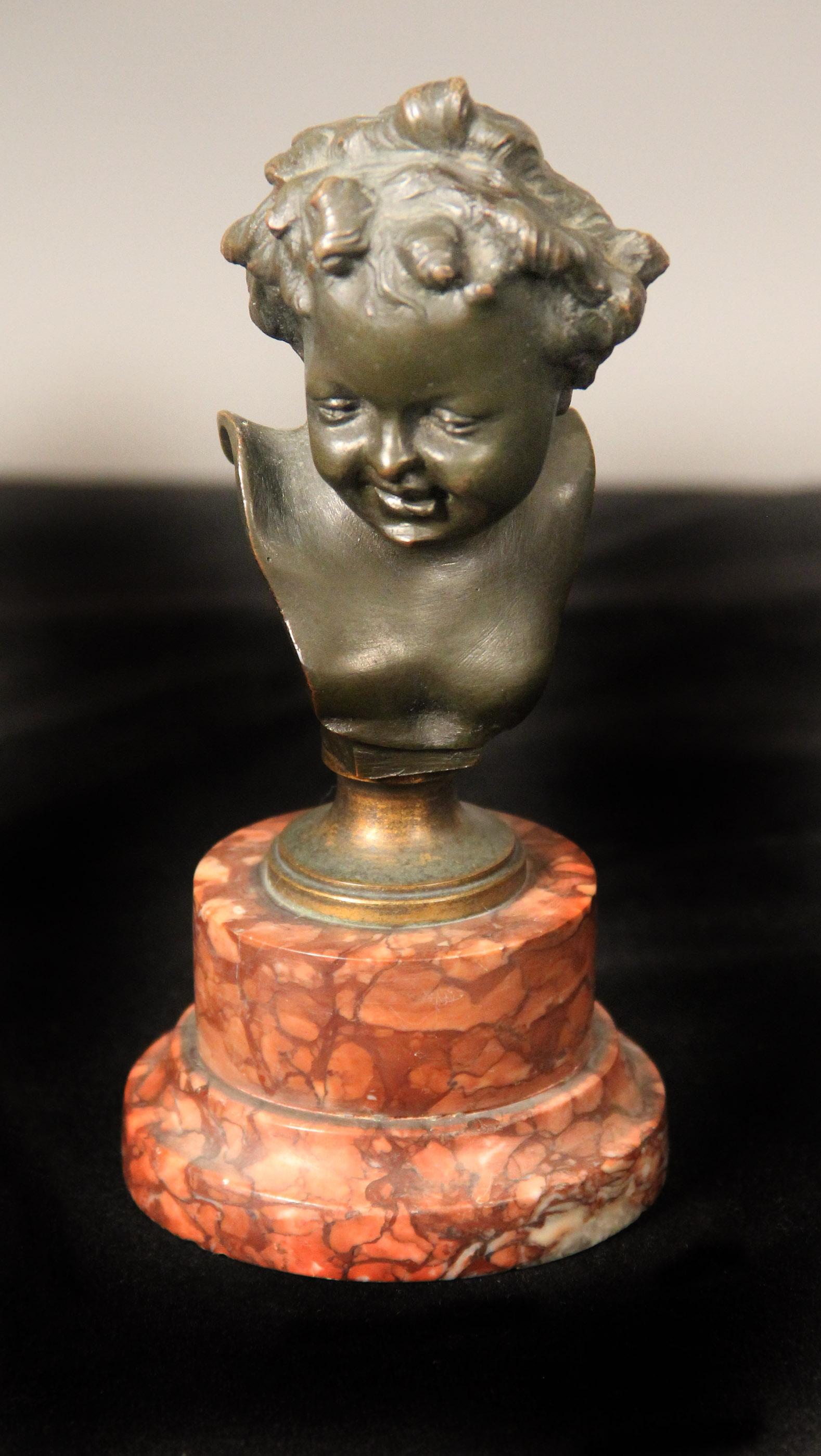 A pair of late 19th century bronze busts

After Clodion

Depicting a bust of a young boy sitting on a rouge marble base.

Signed Clodion on the back of each bust.

Claude Michael Clodion, [1738-1814], was the son-in-law of sculptor Augustin