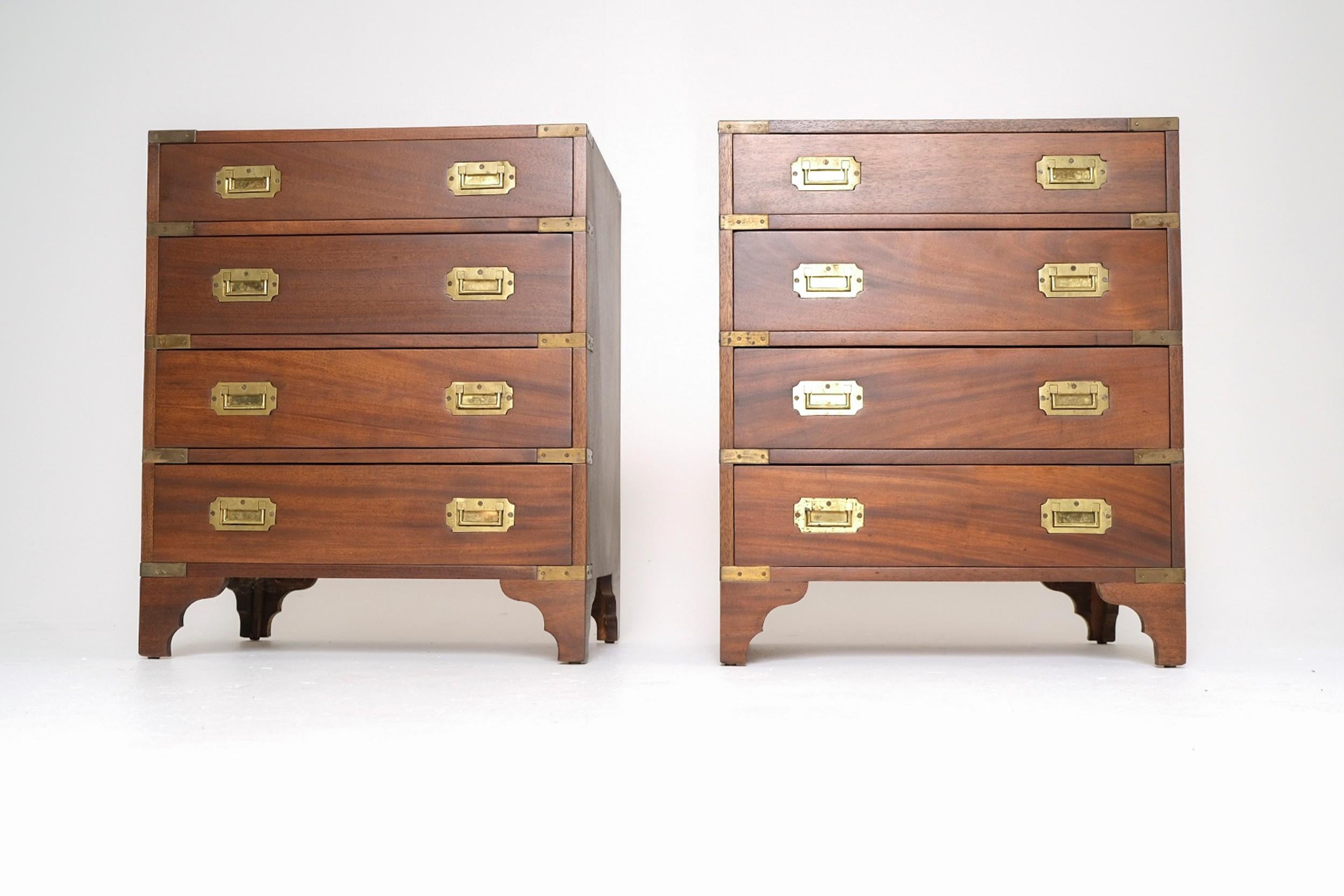 An exceptional pair of late 19th century Spanish campaign chests crafted from solid mahogany, featuring original recessed brass hardware and traditional hand-cut dovetail joinery. These chests exemplify the elegance and durability of campaign-style