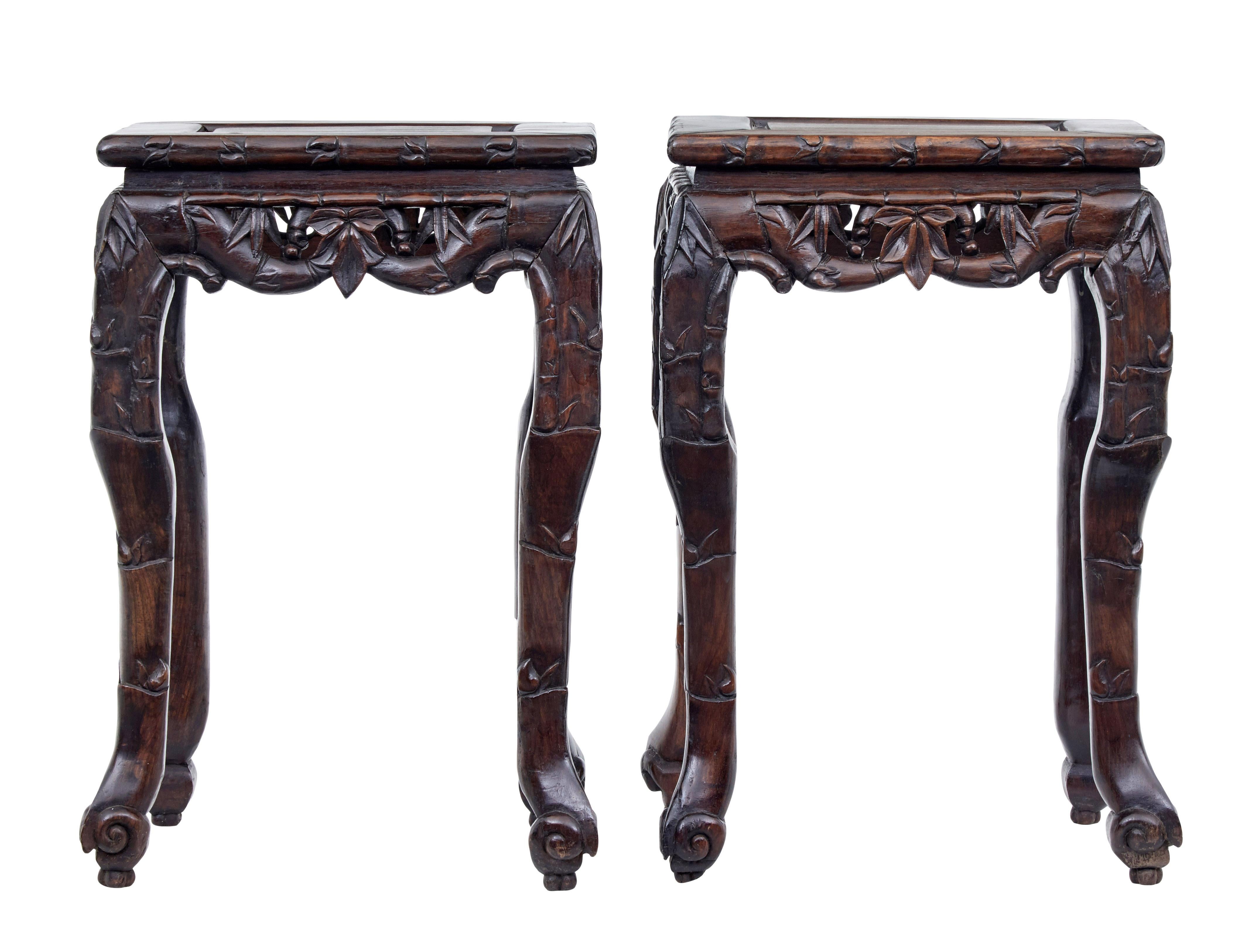 Good quality pair of carved Chinese tables, circa 1890.

These pieces could either be used as stools or as lamp tables. Rectangular top with carving around the edge. Further pierced carving around the frieze.

Further carving simulating bamboo