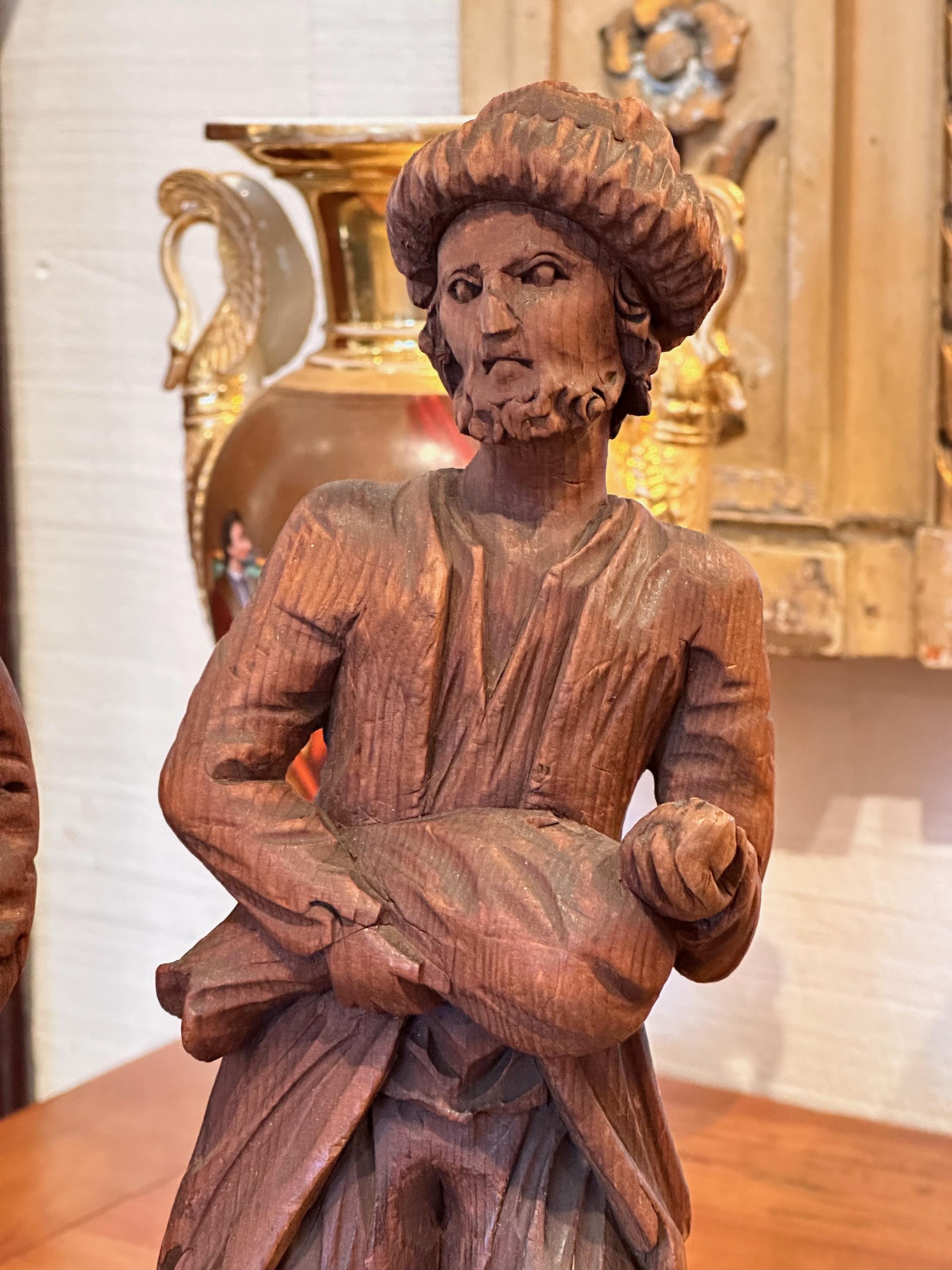 Peasant figures carved from wood. Great detail.