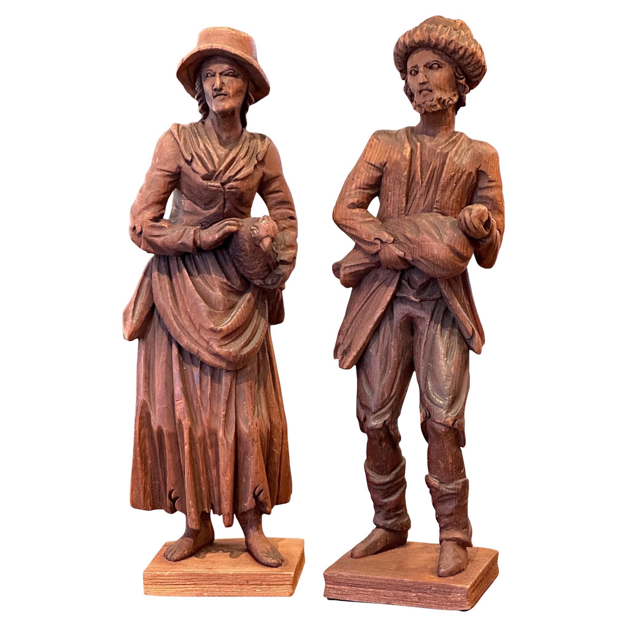 Pair of Late 19th Century Carved Peasants For Sale