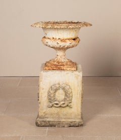 Pair of Late 19th Century Cast Iron Urns with Mid-20th Century Composition Stone