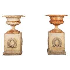 Pair of Late 19th Century Cast Iron Urns with Mid-20th Century Composition Stone