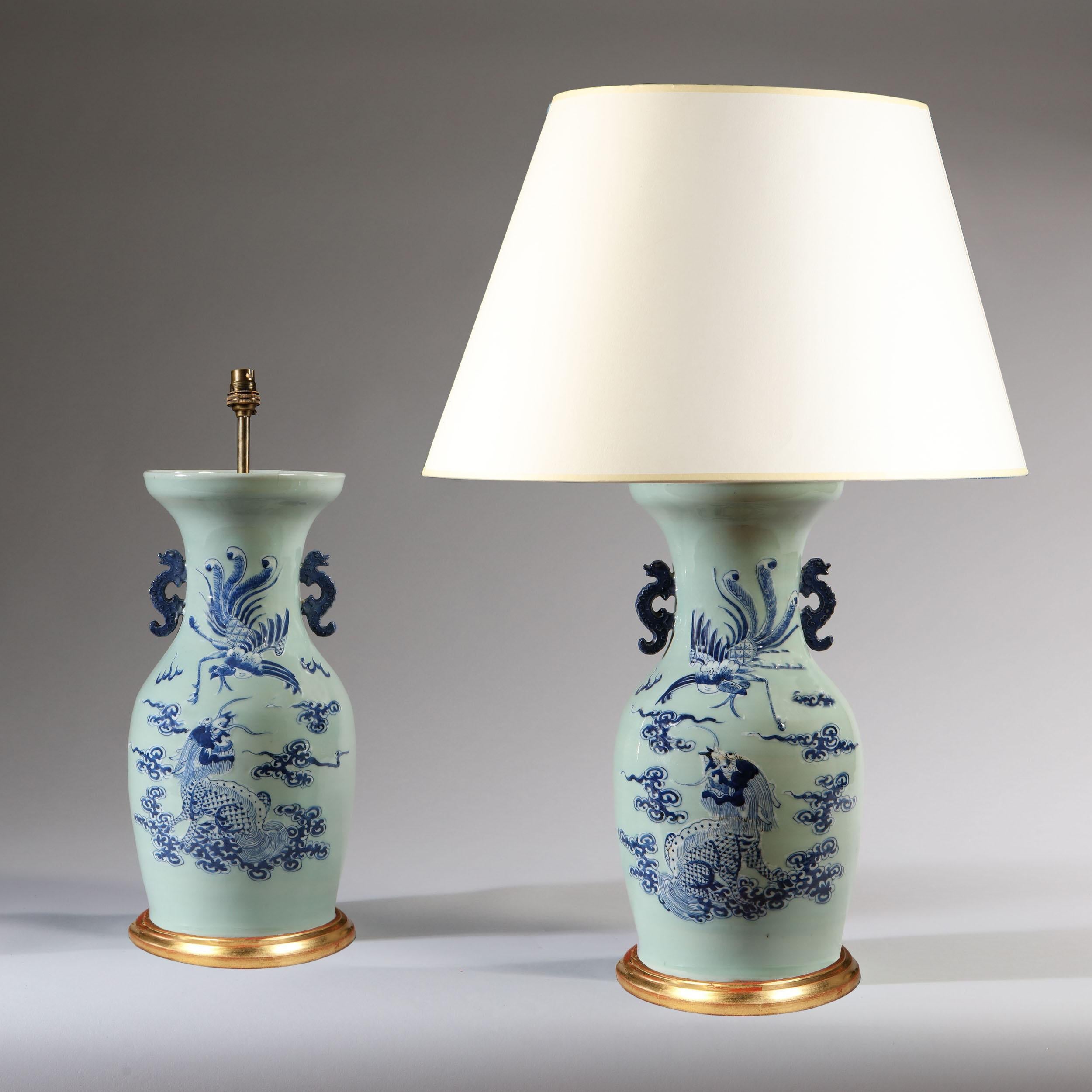 A fine pair of late 19th century Celadon vases decorated with dragons in under glaze blue, now mounted as lamps with giltwood bases.

Please note: lampshades not included.

Currently wired for the UK. Please enquire for rewiring services.