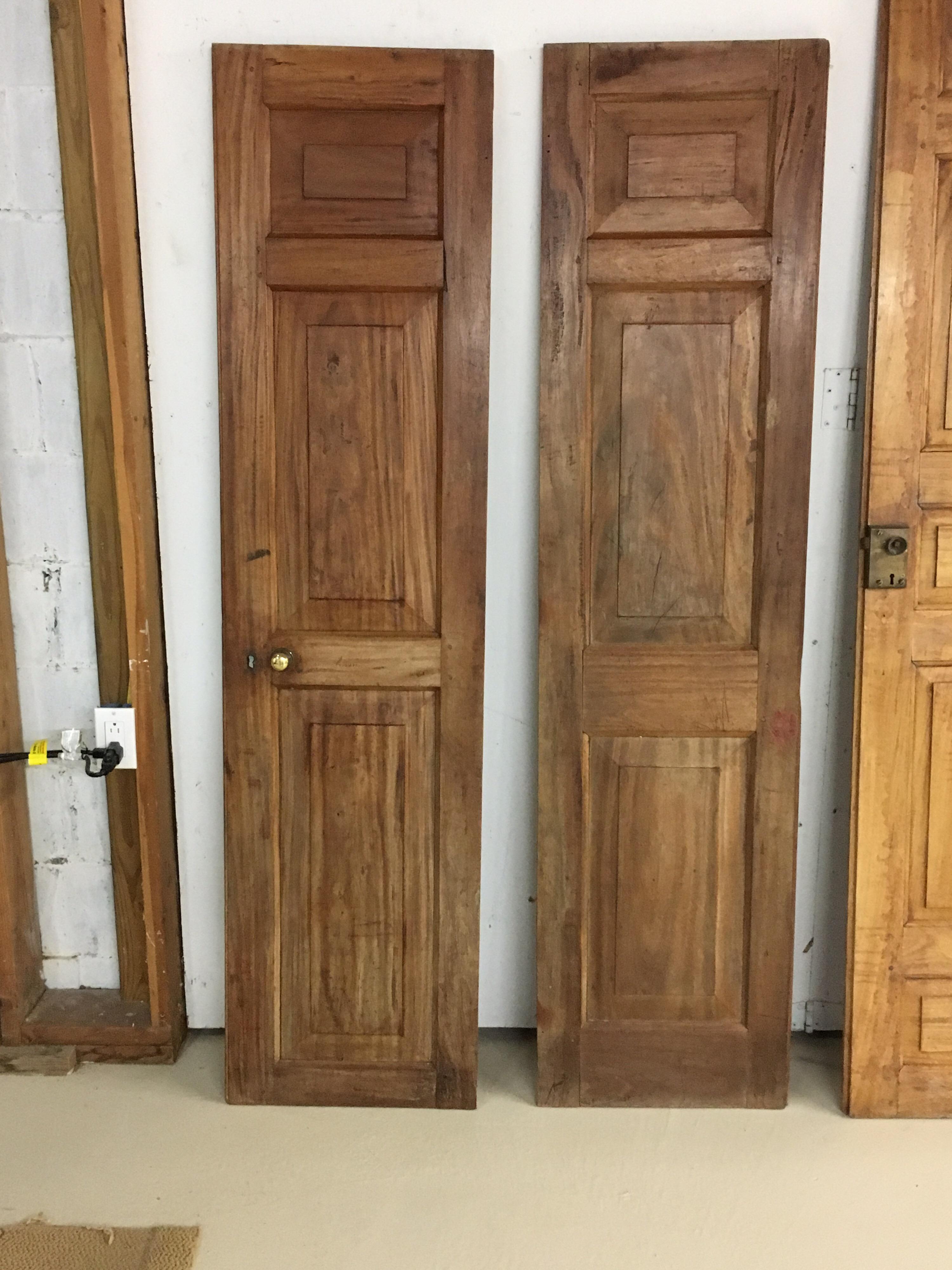 Pair of late 19th century Ceylonese solid satinwood paneled interior doors, circa 1890s. Beautiful door with old hardware but not original. Doors meet and join together. Solid satinwood and great patina from age and use.

Provenance: Harrington