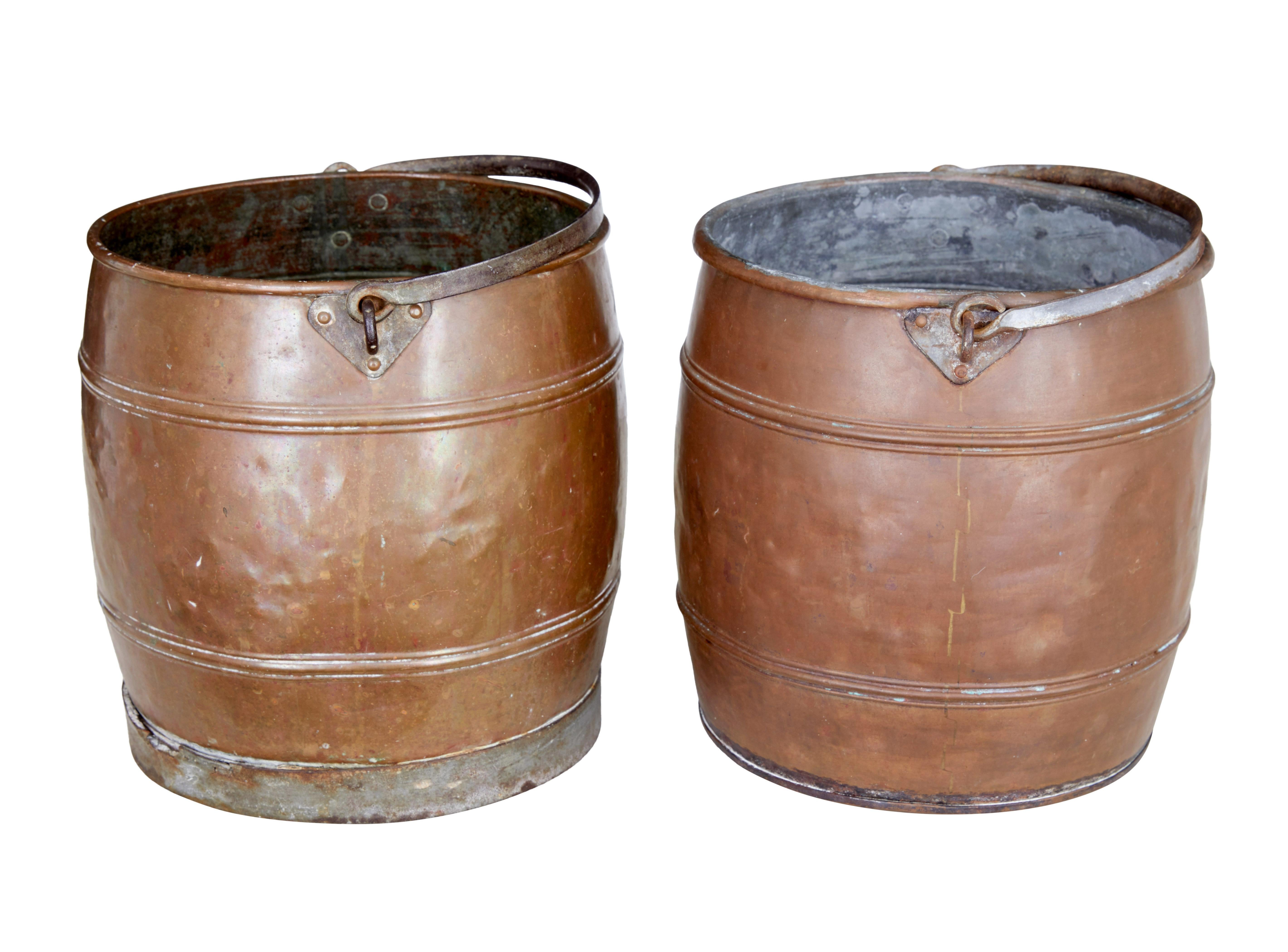 Pair of late 19th century copper buckets circa 1890.

Near pair of copper pails.  Ribbed detailing with steel handles.  1 pail which has corroded through the bottom and is only suitable for display purposes.

Ideal for fireside kindling
