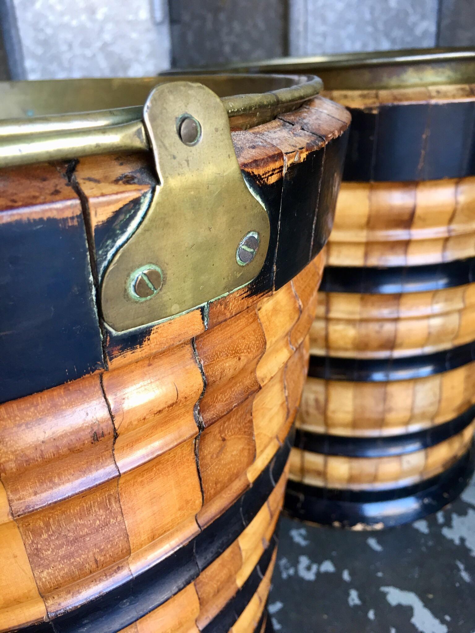 These buckets would have stored peat bricks used for heating homes. Decorative items with fruitwood and ebonized wood banding. With brass handles.