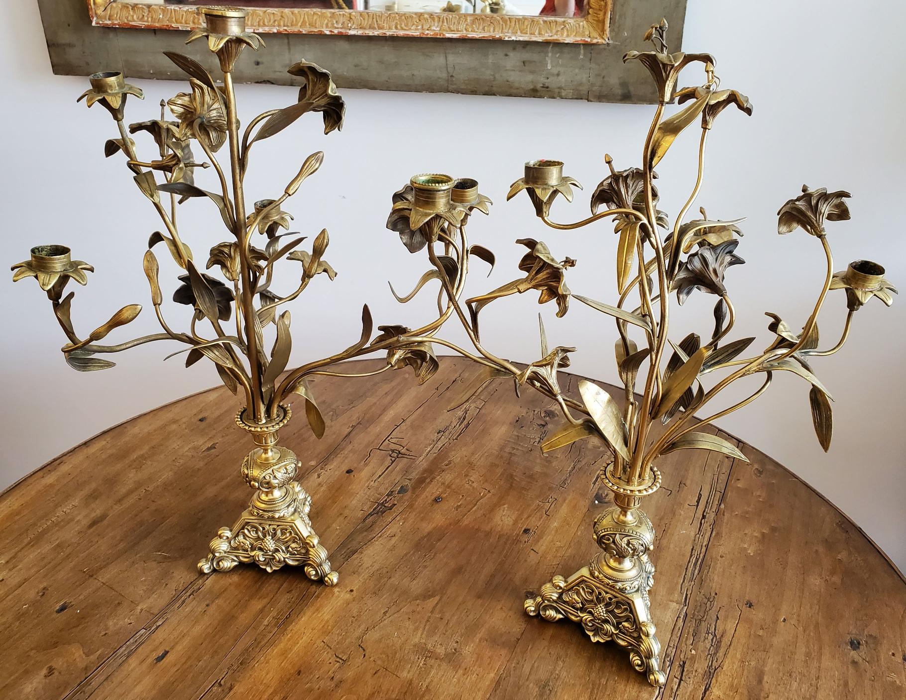 Pair of late 19th century French brass flower candelabra. Made of deeply patinated brass with intricately cast flower and leaf motifs. These are so beautiful, they will quickly become one of your favorite pieces in your home.
France, 1870.
