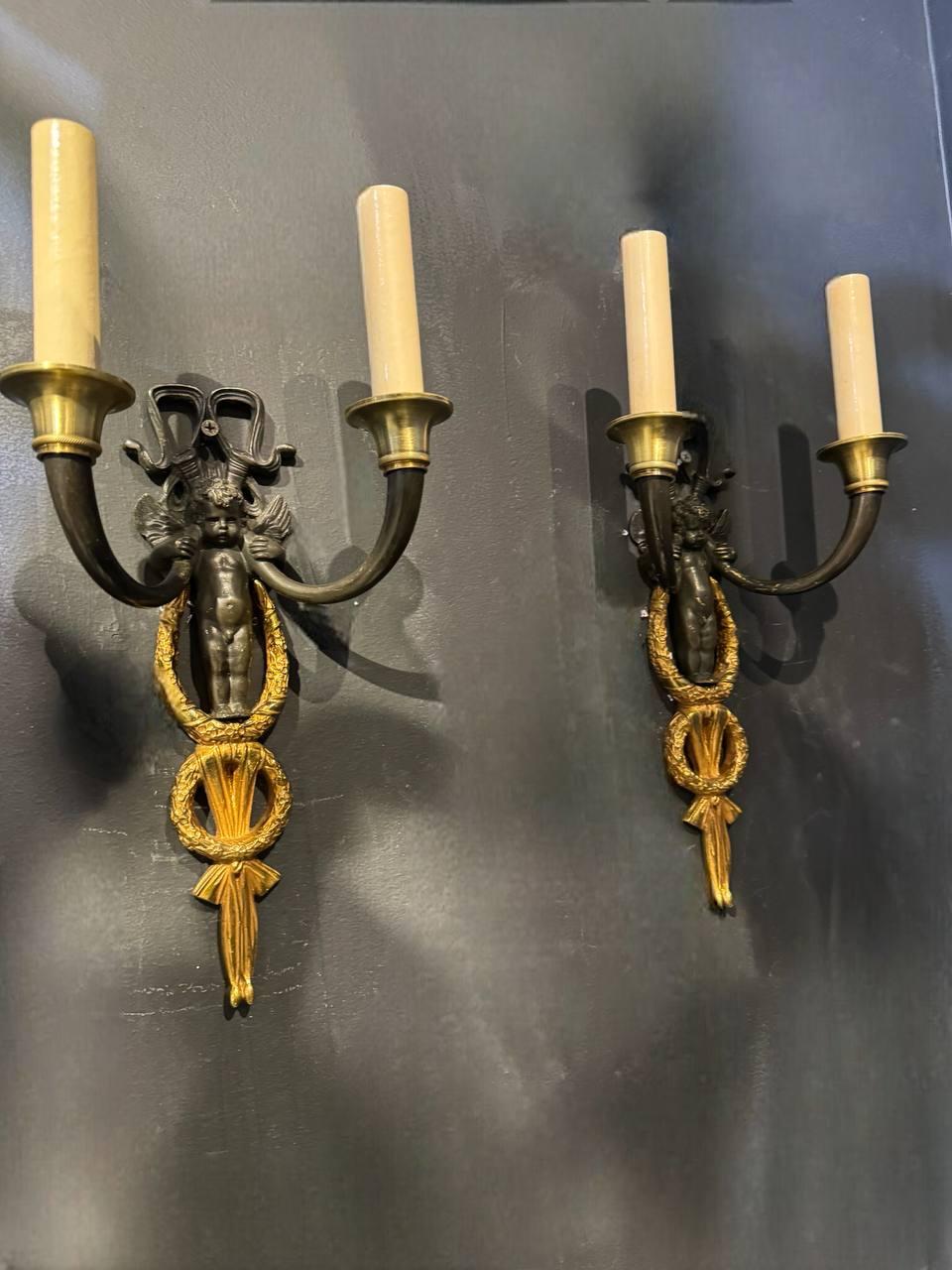 Patinated Pair of Late 19th Century French Empire Cherubs Sconces For Sale