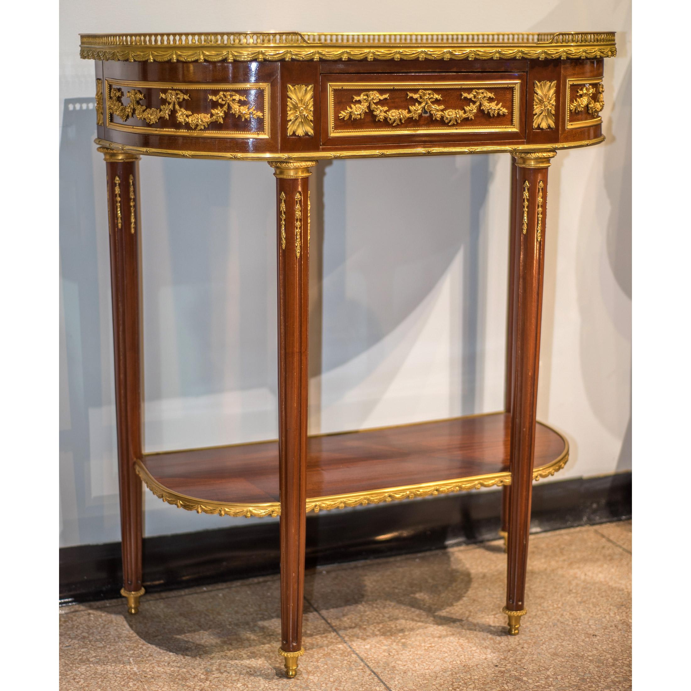 Marble Pair of Late 19th Century French Gilt Bronze Mounted Mahogany Consoles For Sale