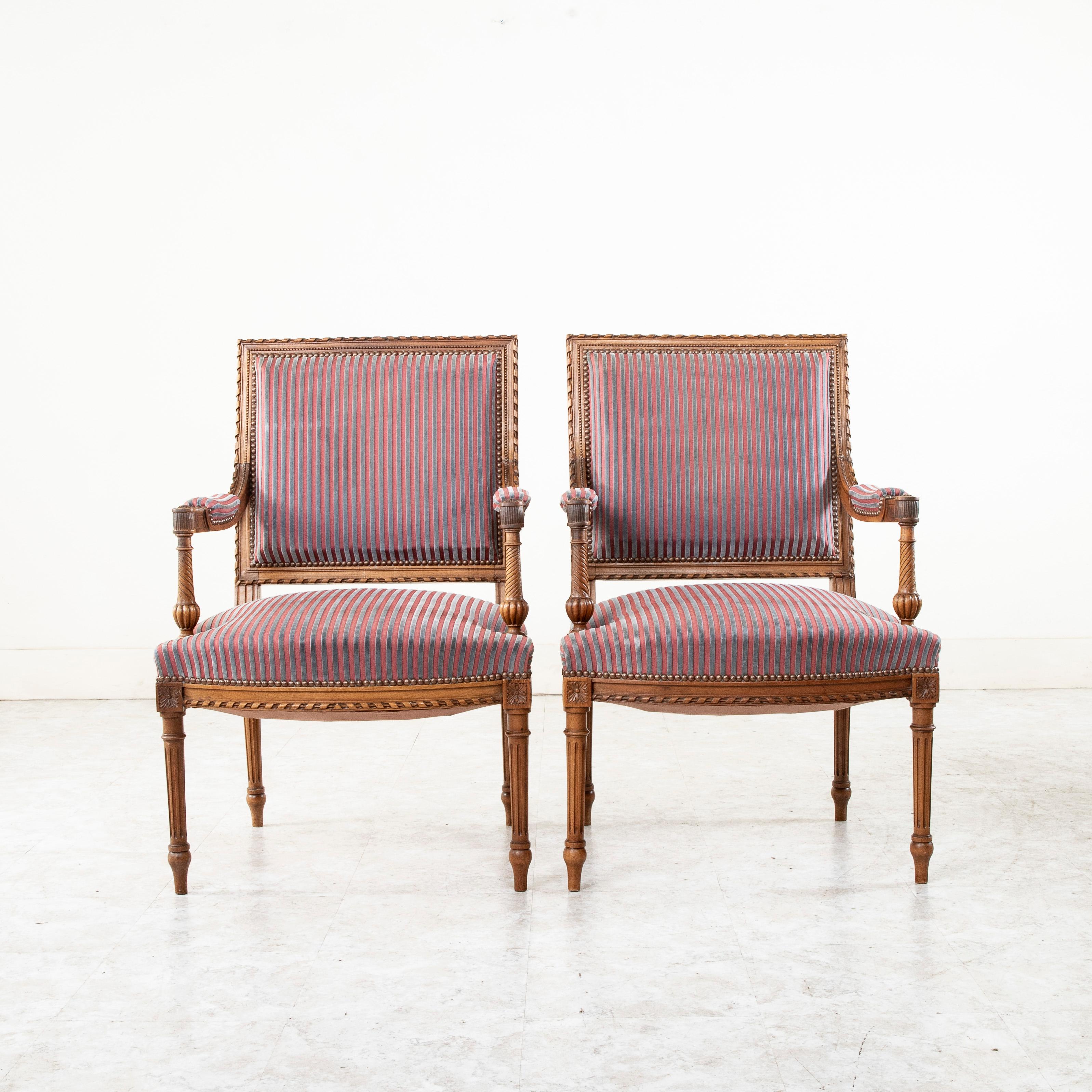 Hand-Carved Pair of Late 19th Century French Louis XVI Style Hand Carved Walnut Armchairs For Sale