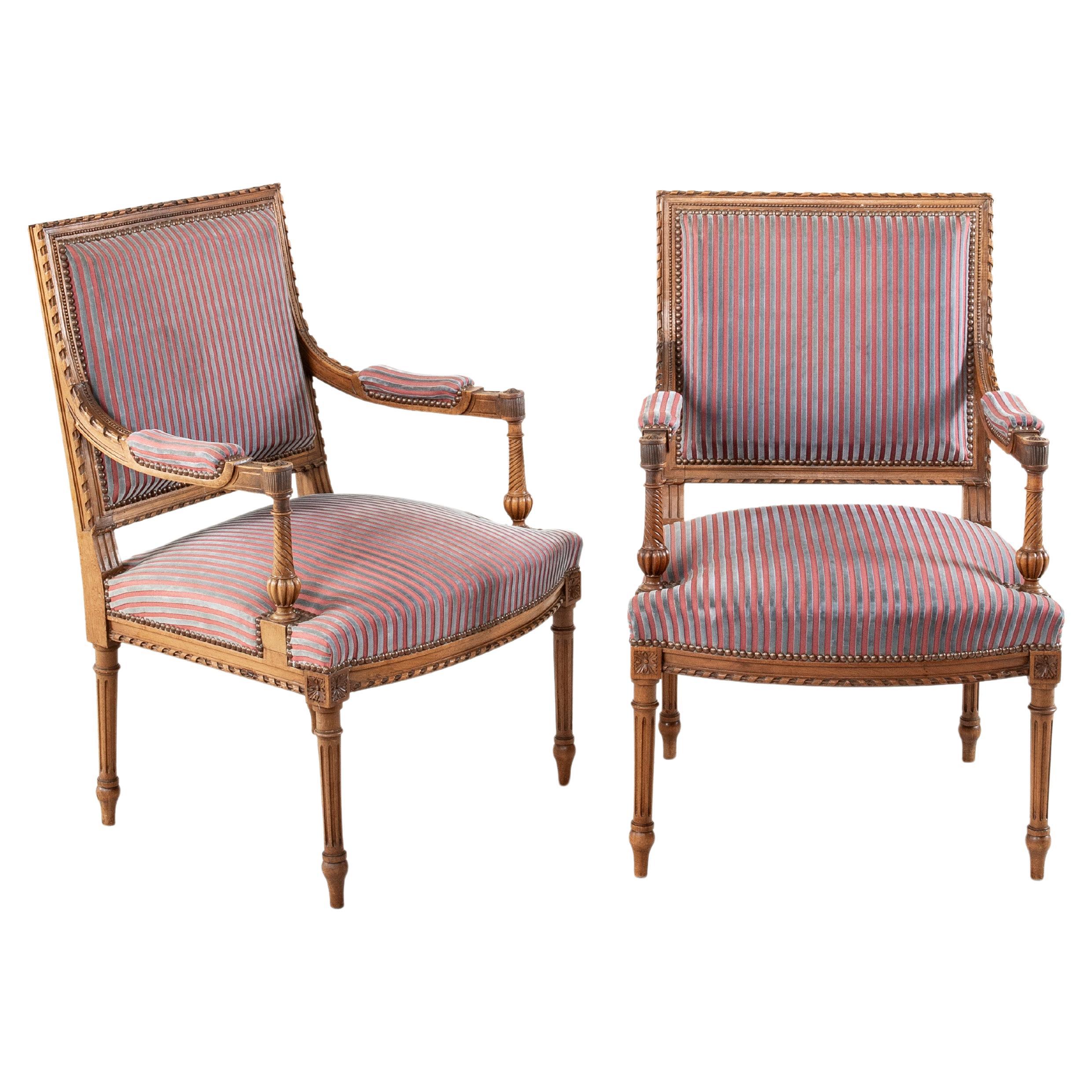 Pair of Late 19th Century French Louis XVI Style Hand Carved Walnut Armchairs