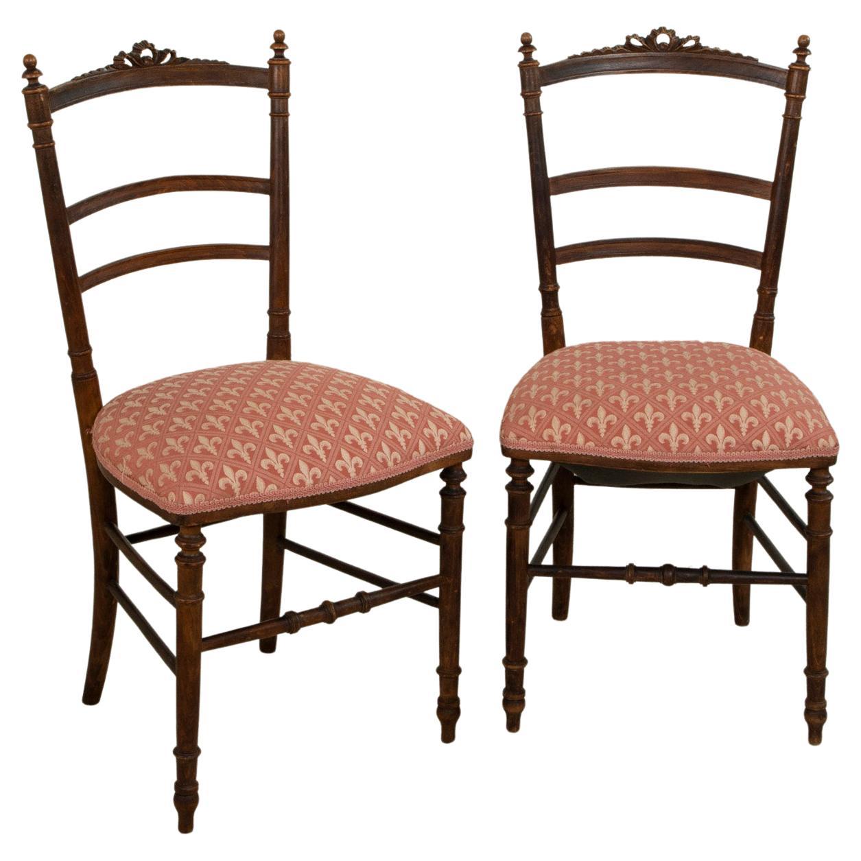 Pair of Late 19th Century French Louis XVI Style Hand Carved Walnut Opera Chairs For Sale