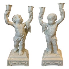 Pair of Late 19th Century Italian Creamware Putti Two-Arm Candelabras