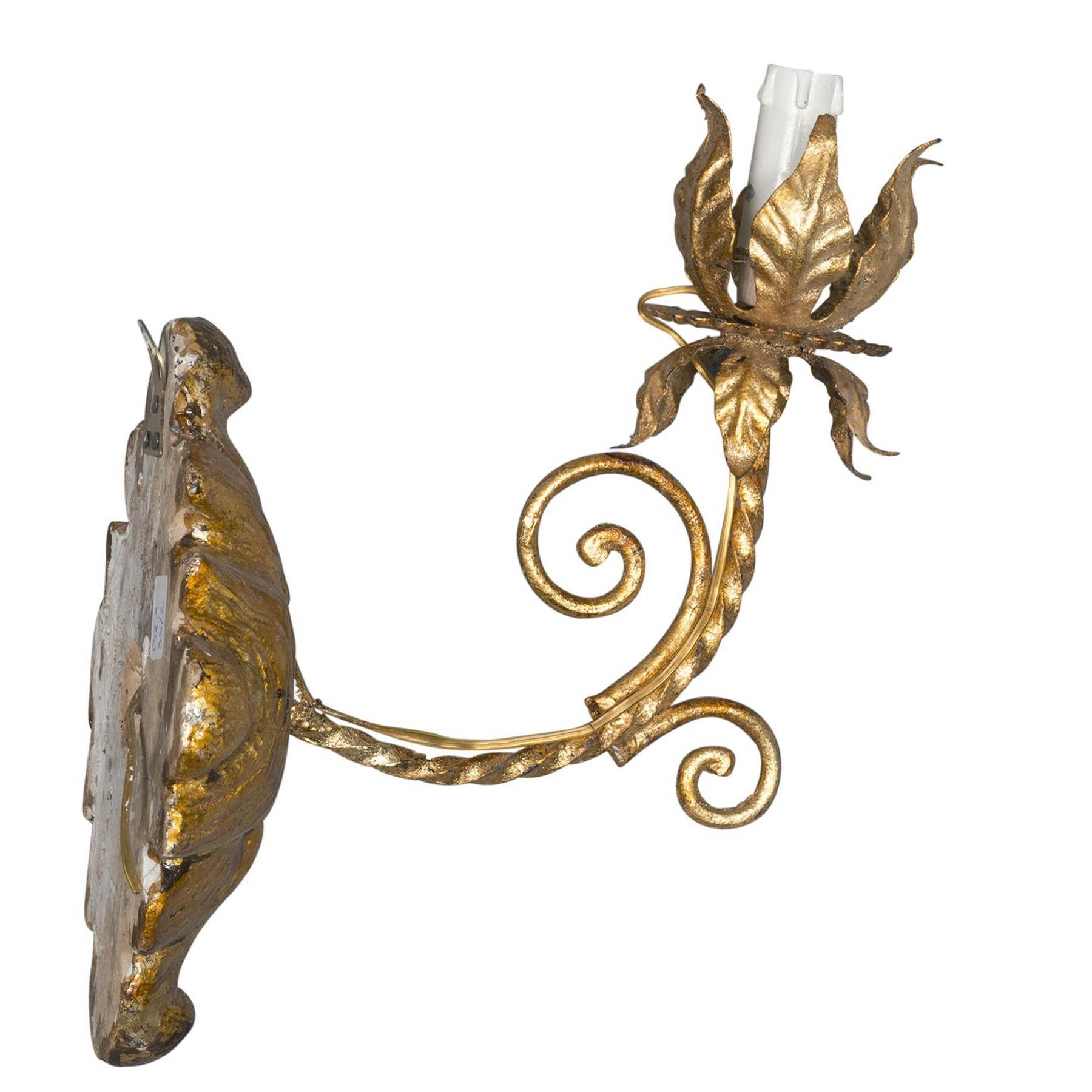 Anonymous
Late 19th century; Italy
Gilt wood and iron

Approximate size: 9.75 (h) x 6.75 (w) x 9 (d) inches

An elegant pair of gilt wood and iron wall sconces of probable late 19th century Italian origin. A leaf motif forms the wall mounts while