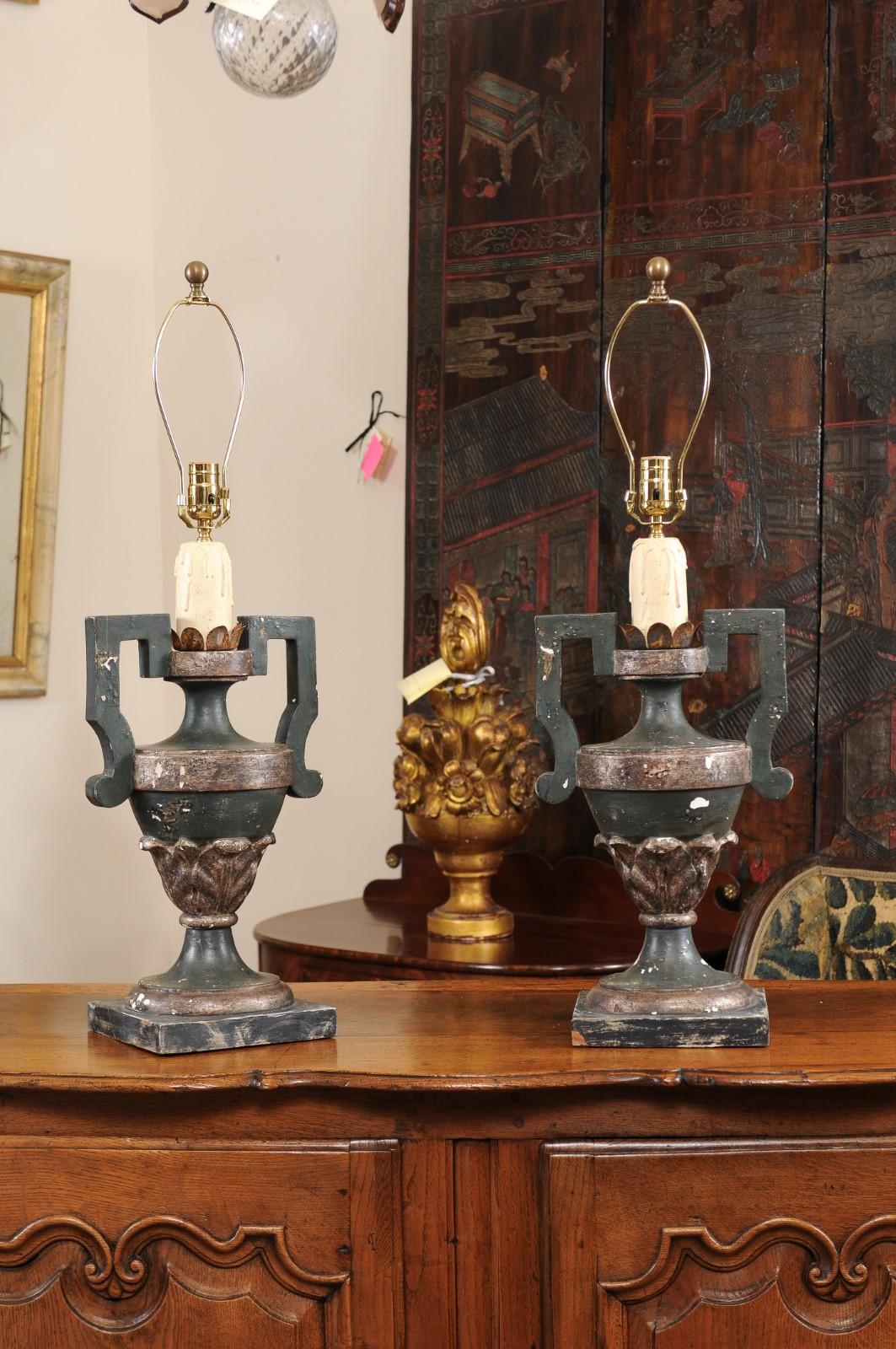 The pair of Italian painted urn shaped lamps in dark green and silver hues. Recently wired for U.S electricity. The height is 23