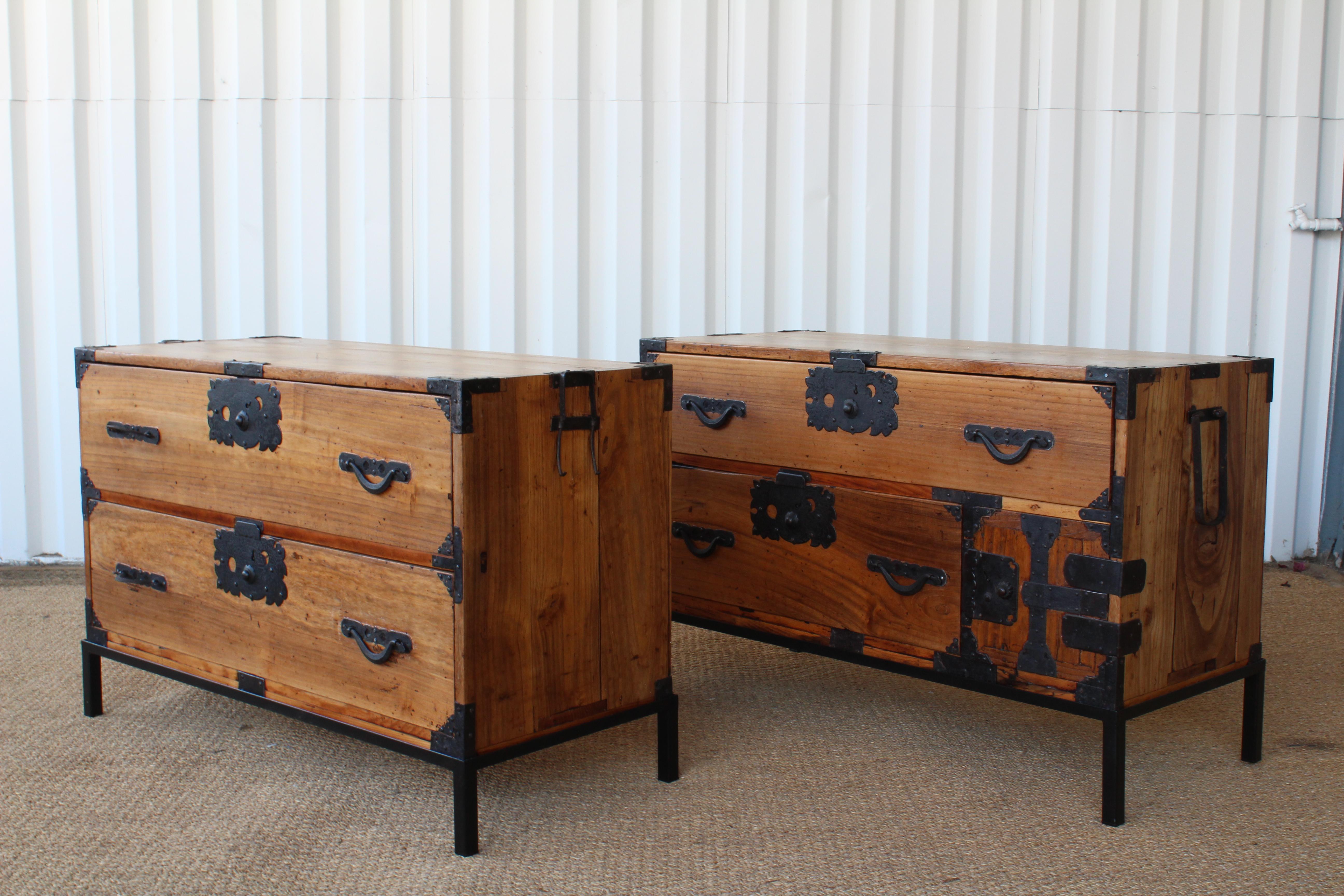 Pair of late 19th century tansu chests from Sendai Island, constructed in Japanese pine with iron accents. Newly refinished with custom metal bases. Iron hardware shows age appropriate wear. Sold as a pair.