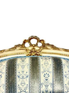 Pareja de sillones Bergères de madera dorada estilo Luis XVI de finales del siglo XIX