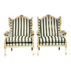 Pareja de sillones Bergères de madera dorada estilo Luis XVI de finales del siglo XIX